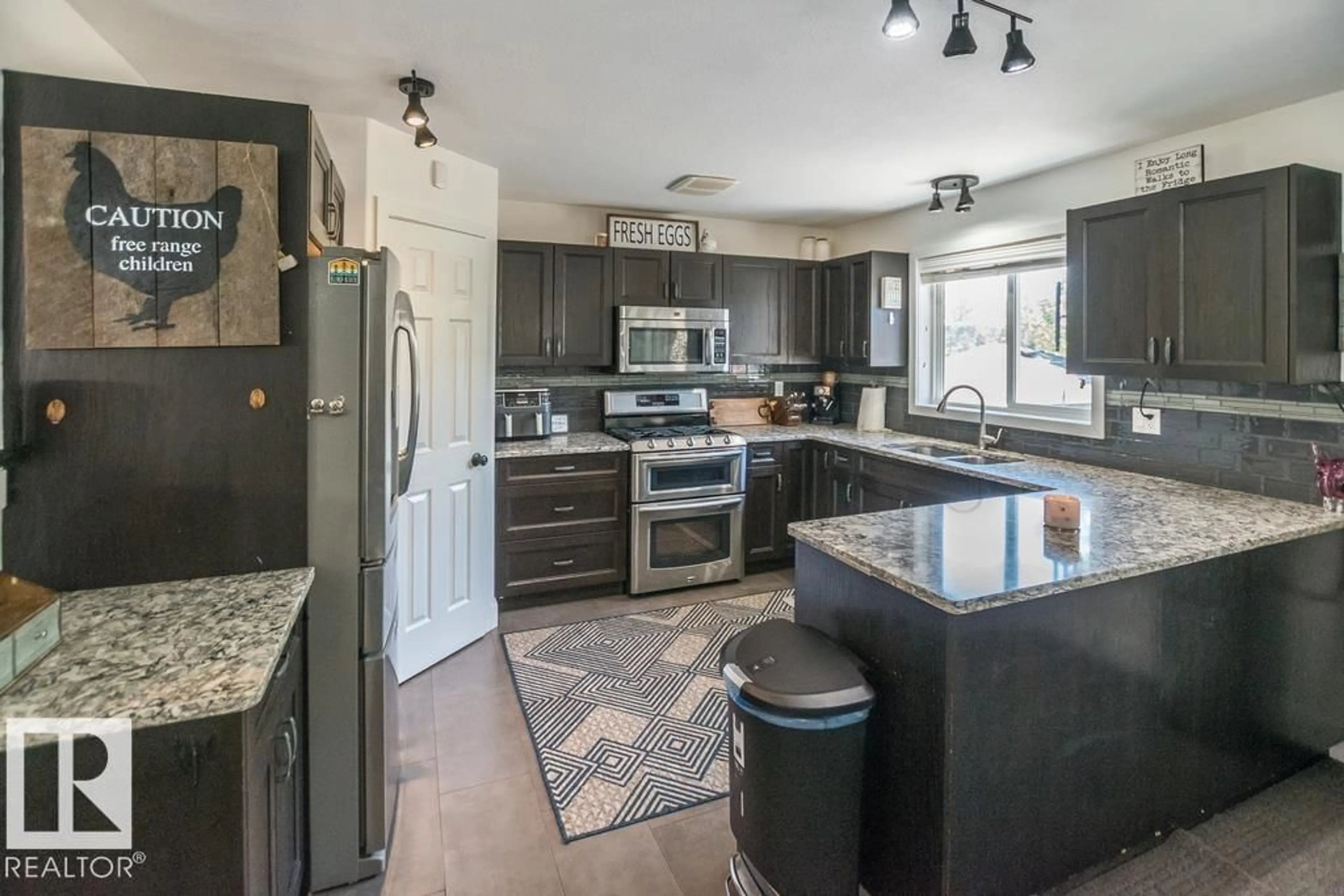 Open concept kitchen, ceramic/tile floor for 46410 - 446 TWP RD 610, Rural Bonnyville M.D. Alberta T9N1J6