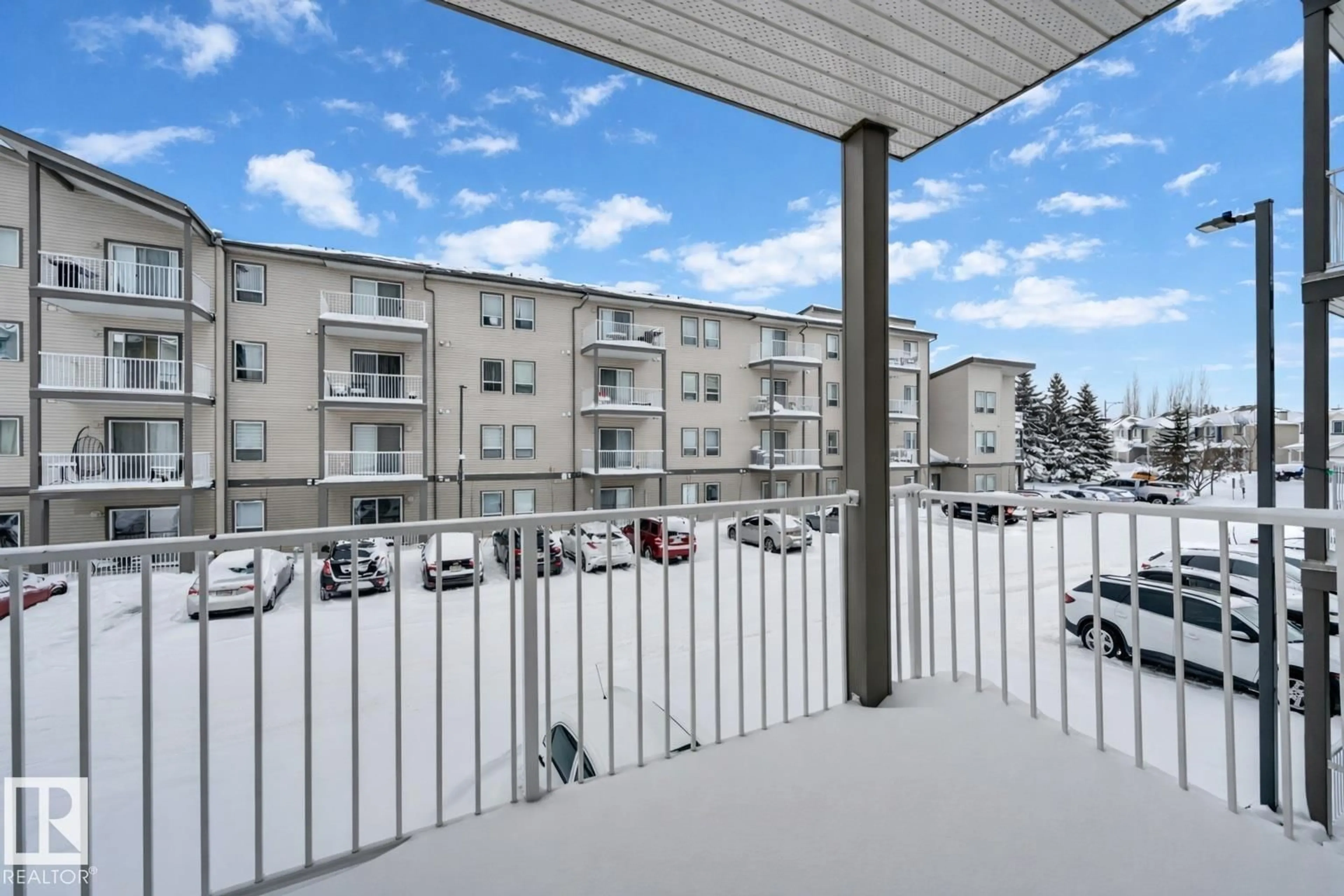 Patio, city buildings view from balcony for #201 - 155 EDWARDS DR, Edmonton Alberta T6X1N6
