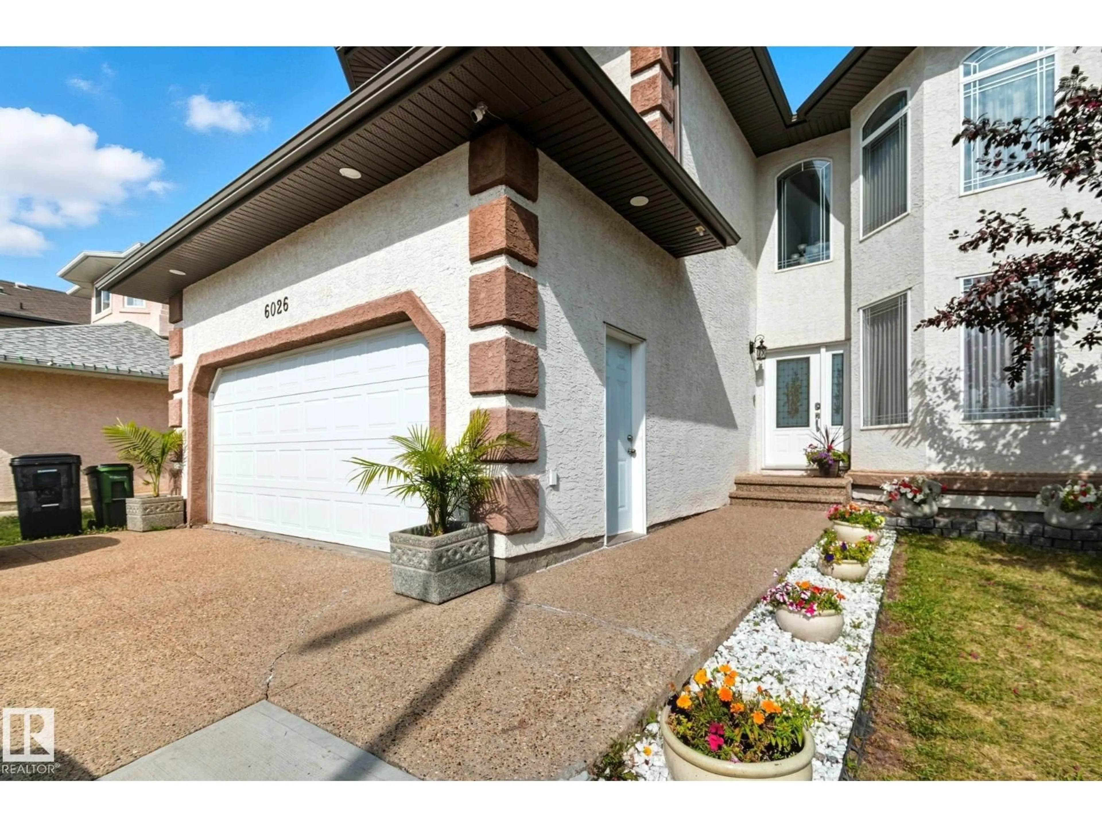 Home with brick exterior material, street for 6026 164A AV, Edmonton Alberta T5Y0A7