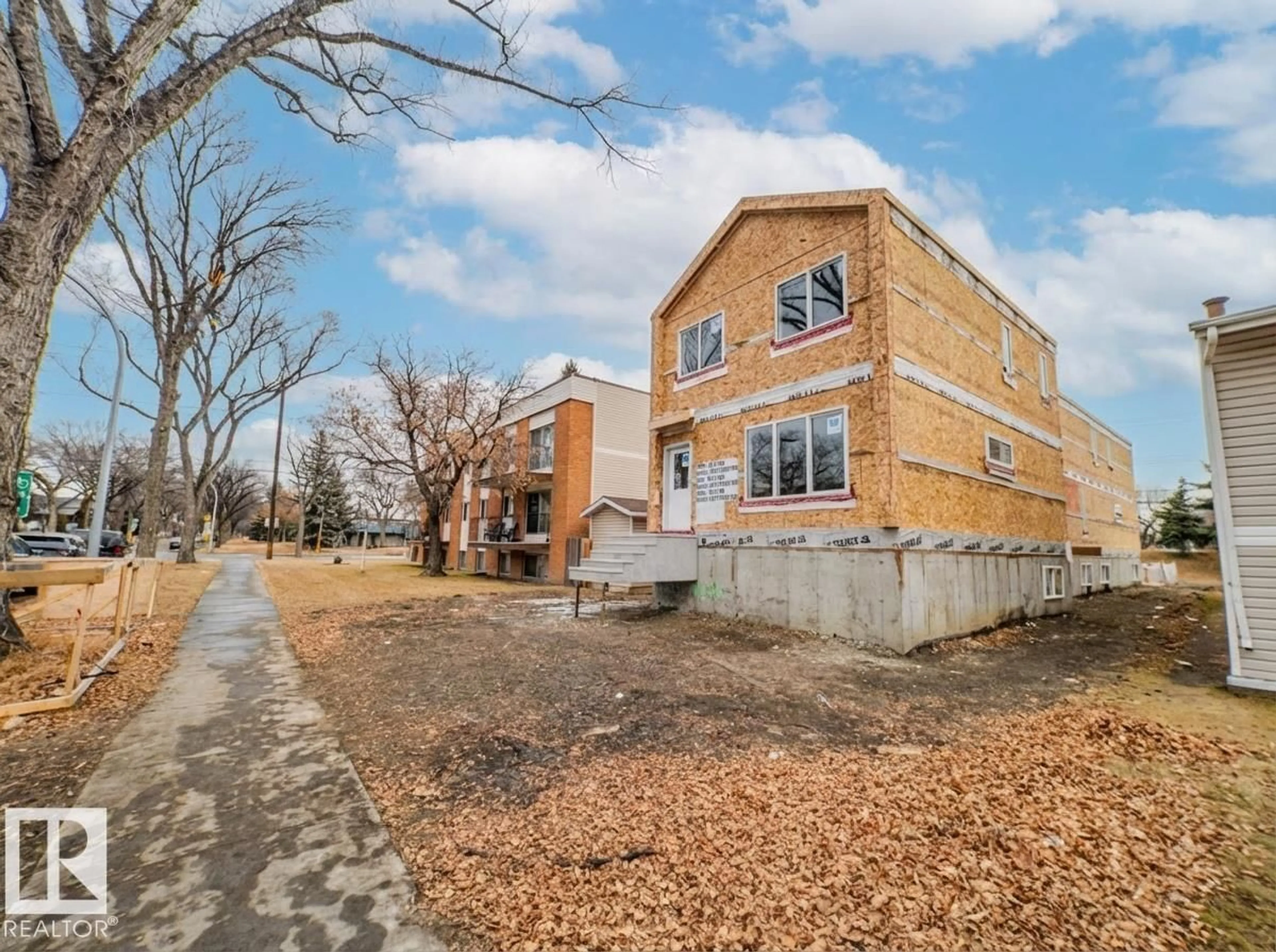 Home with brick exterior material, street for NW - 11939, 11941, 1 101 ST, Edmonton Alberta T5G2B8