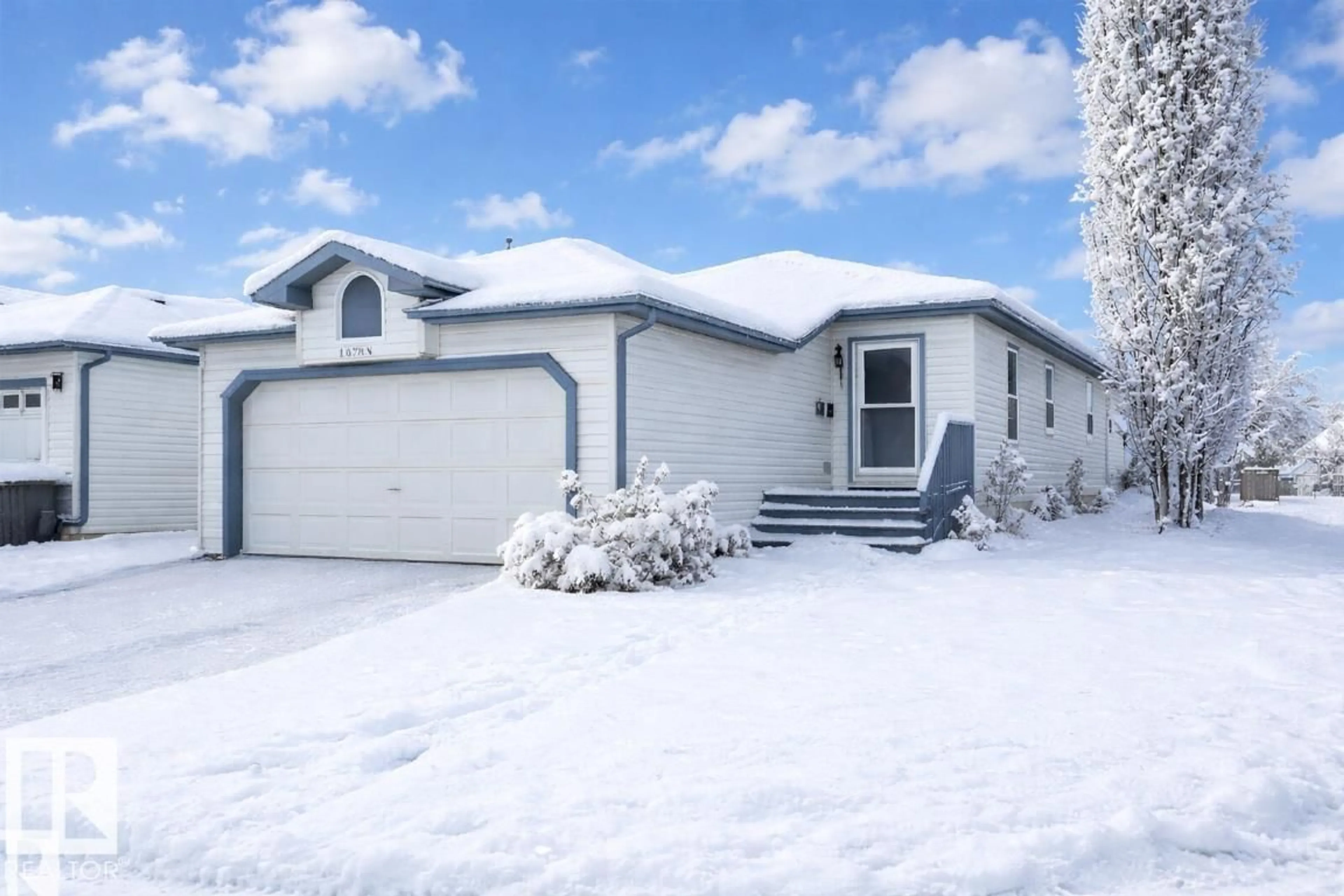 Home with vinyl exterior material, street for NW - 13140 35 ST, Edmonton Alberta T5A5C7