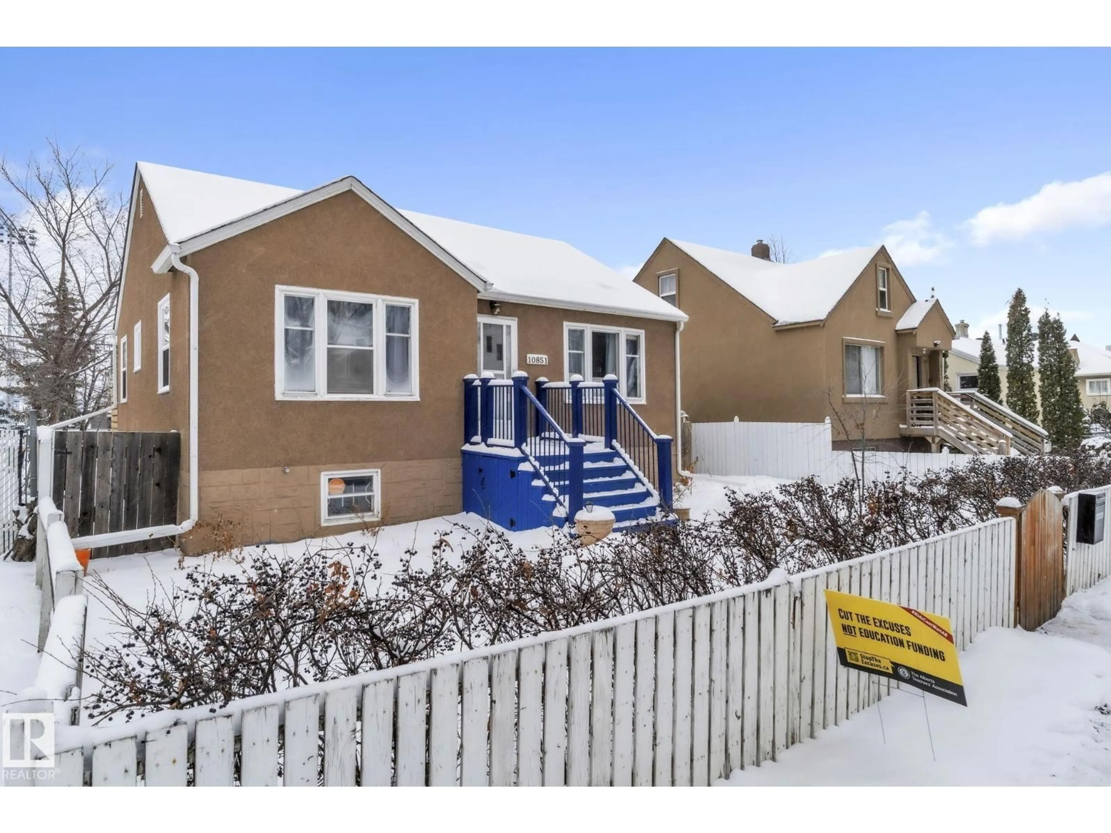 Home with vinyl exterior material, street for 10851 92 ST, Edmonton Alberta T5H1V9