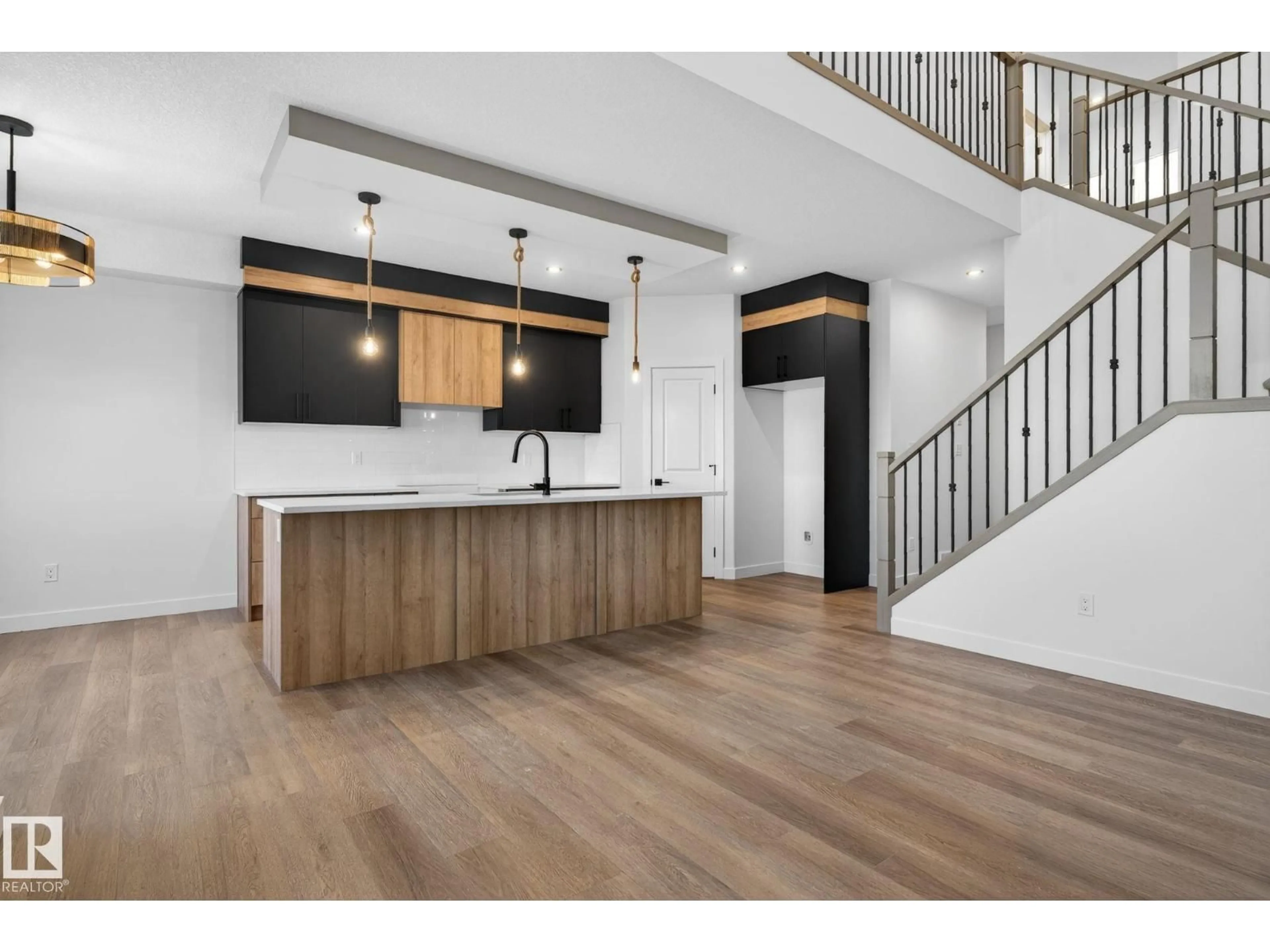 Open concept kitchen, wood/laminate floor for 157 PIERWYCK LO, Spruce Grove Alberta T7X4G3