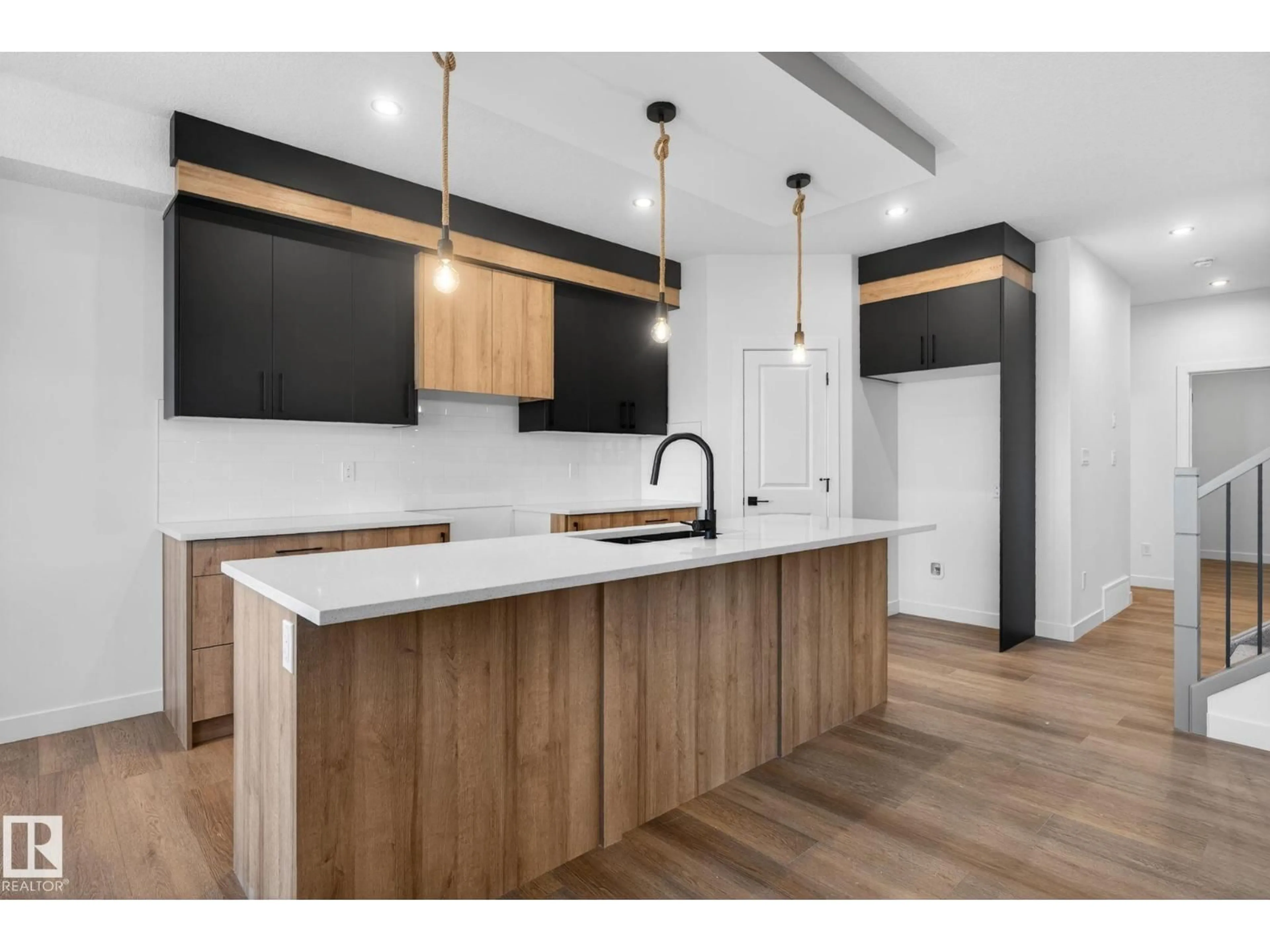 Open concept kitchen, wood/laminate floor for 157 PIERWYCK LO, Spruce Grove Alberta T7X4G3