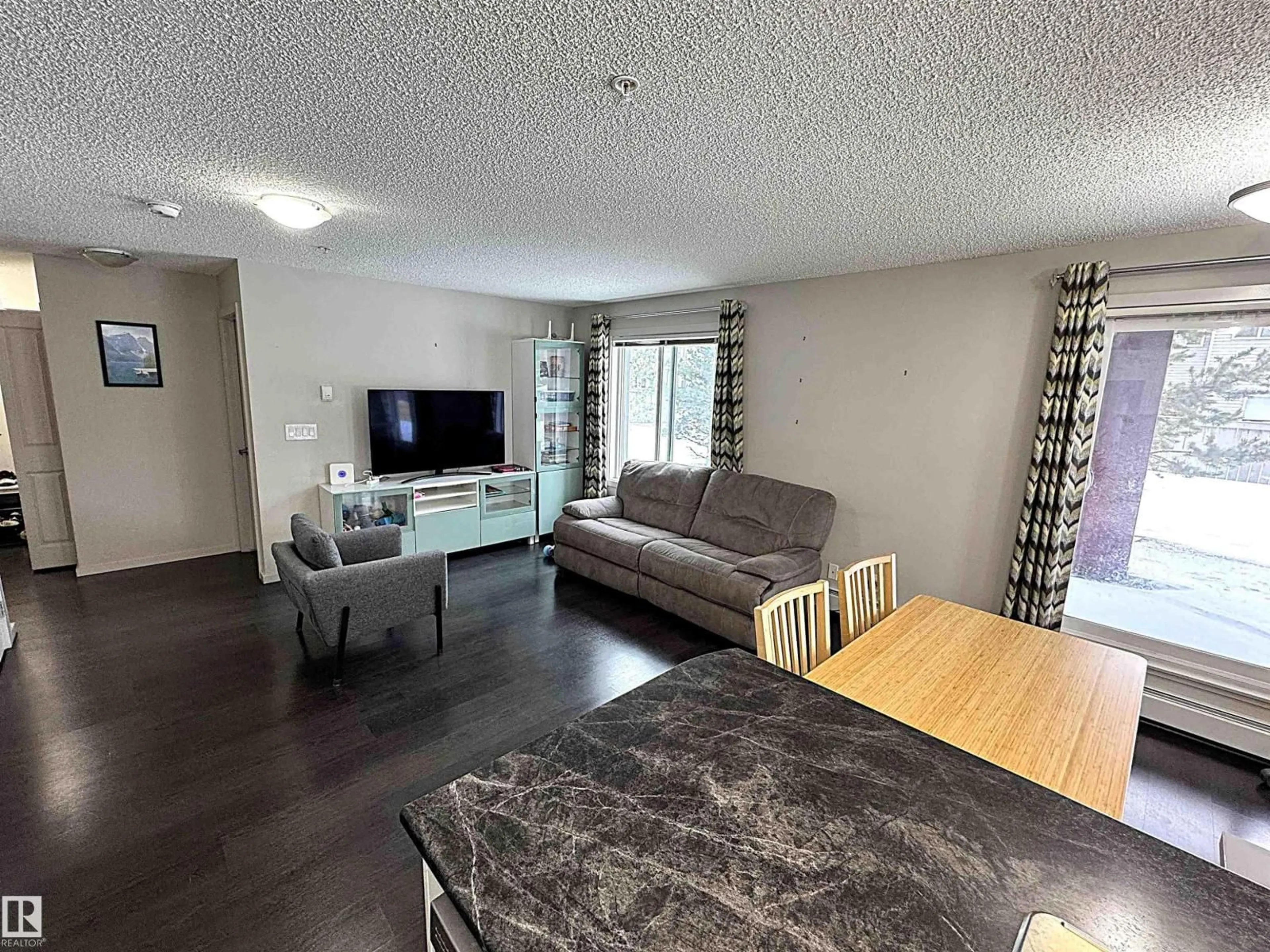 Living room with furniture, unknown for 117 - 5521 7 AV SW, Edmonton Alberta T6X2A8