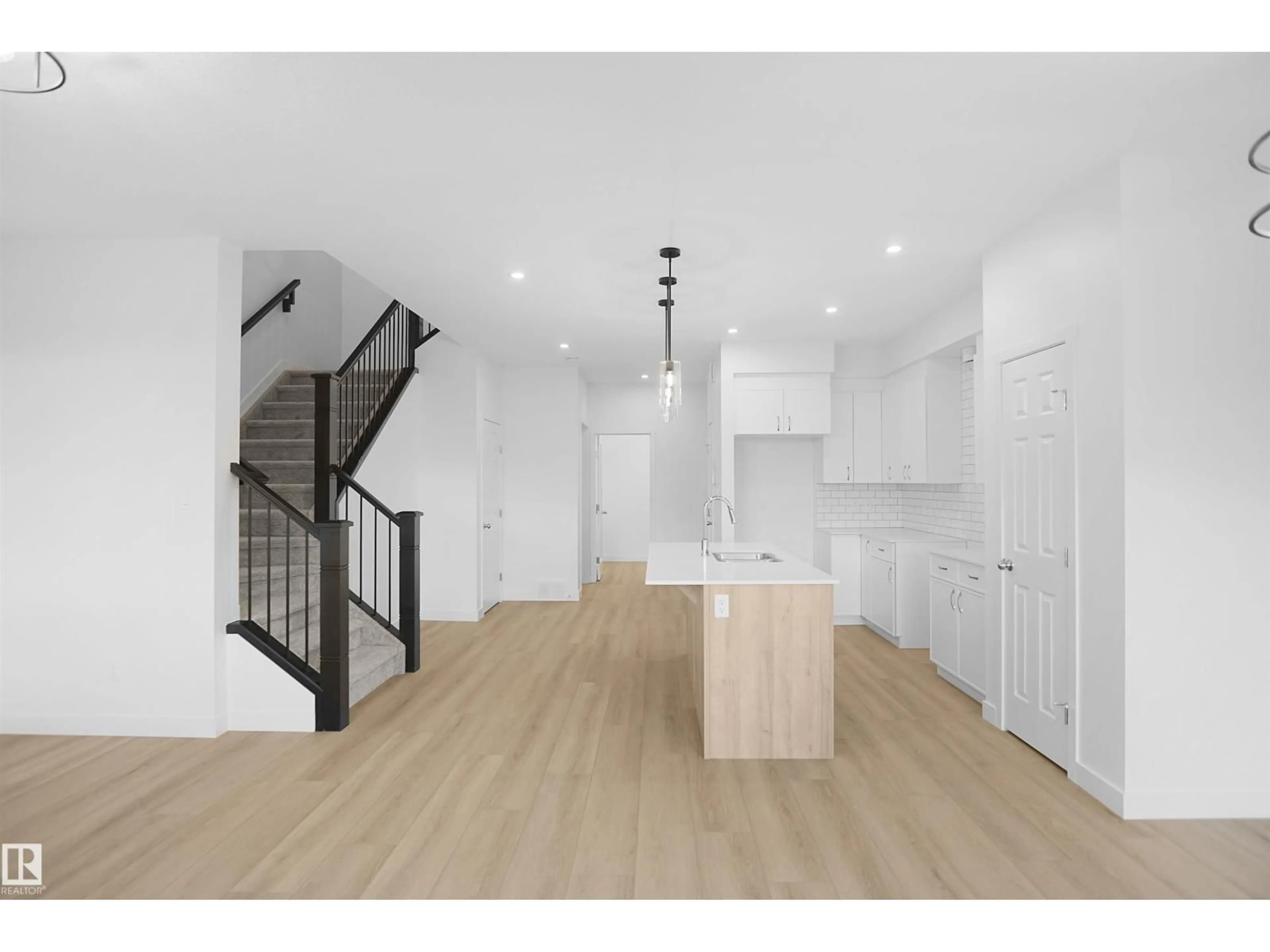 Open concept kitchen, wood/laminate floor for NW - 2258 194A ST, Edmonton Alberta T6M1P9