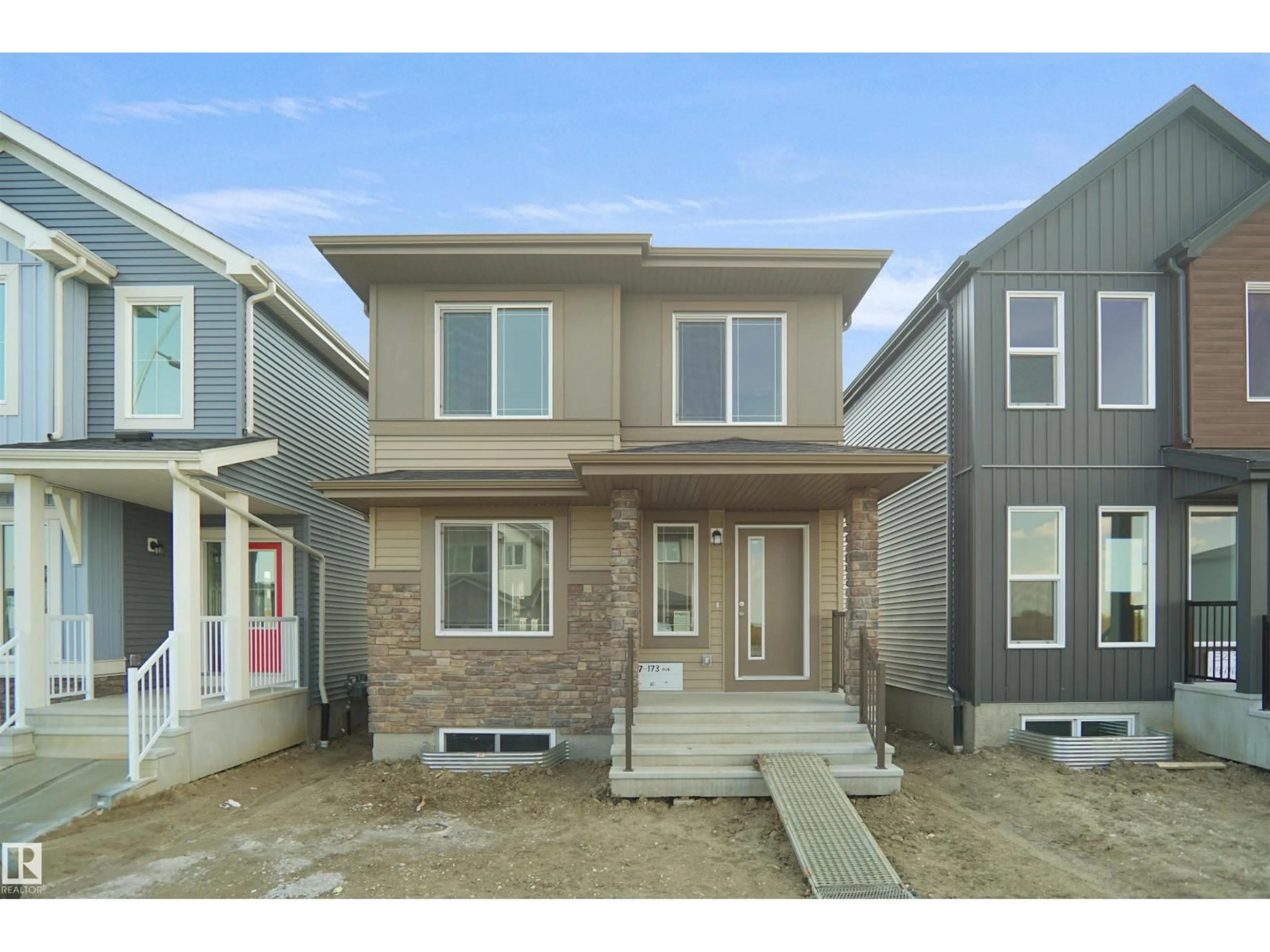 Home with vinyl exterior material, street for NW - 21023 25 AV, Edmonton Alberta T6M1L2