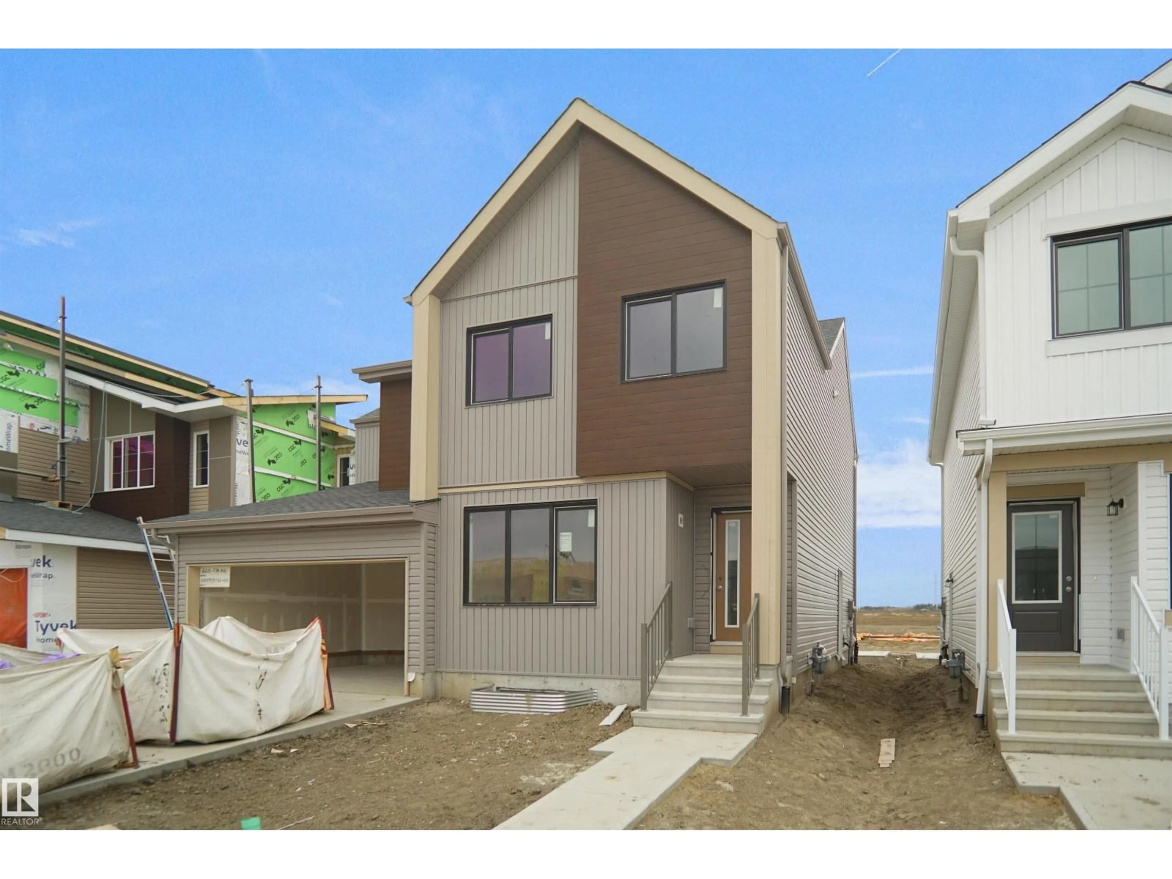 Home with vinyl exterior material, street for NE - 610 176 AV, Edmonton Alberta T5Y4G1