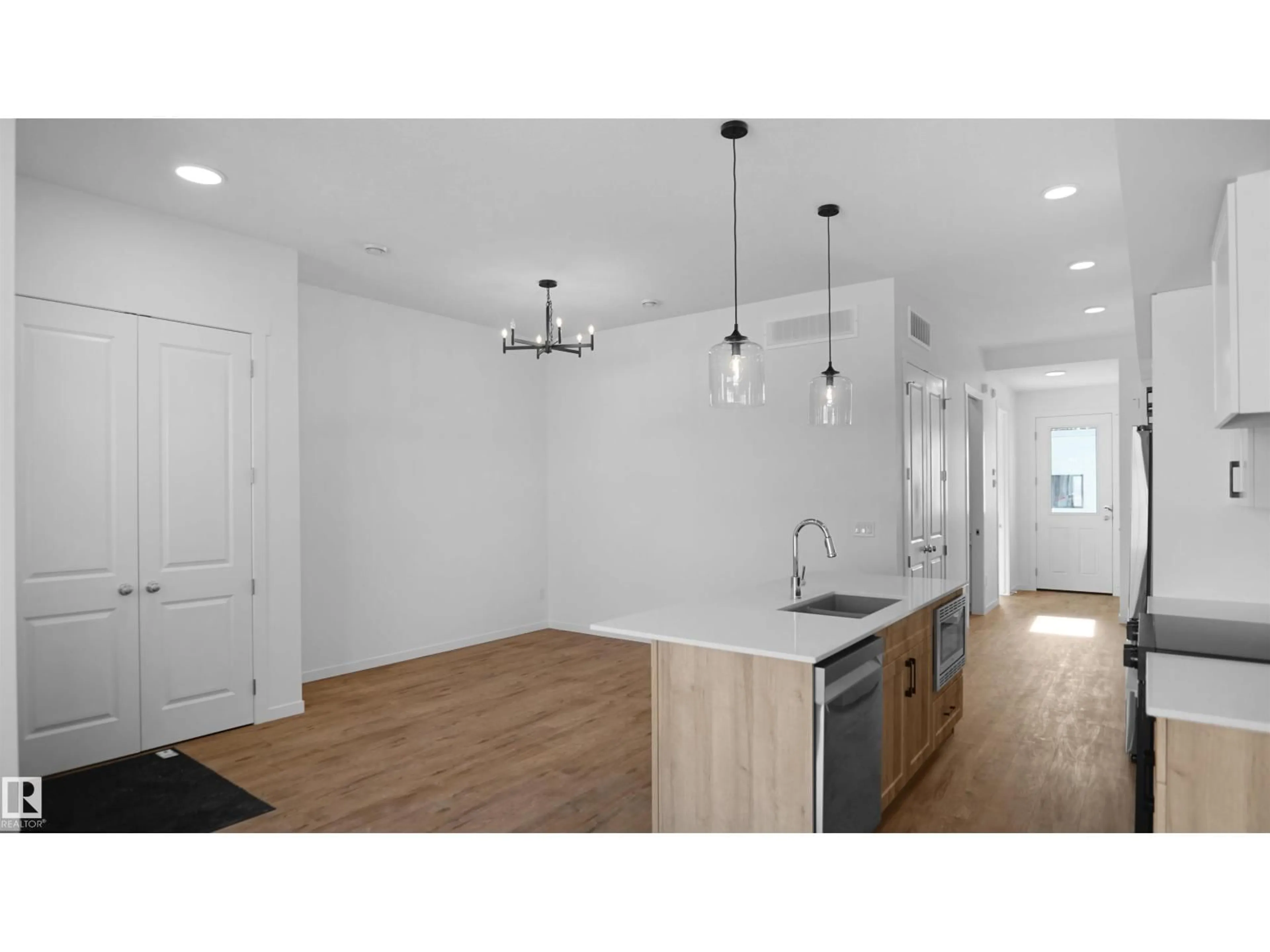 Open concept kitchen, wood/laminate floor for 20605 42 AV, Edmonton Alberta T6M0R8