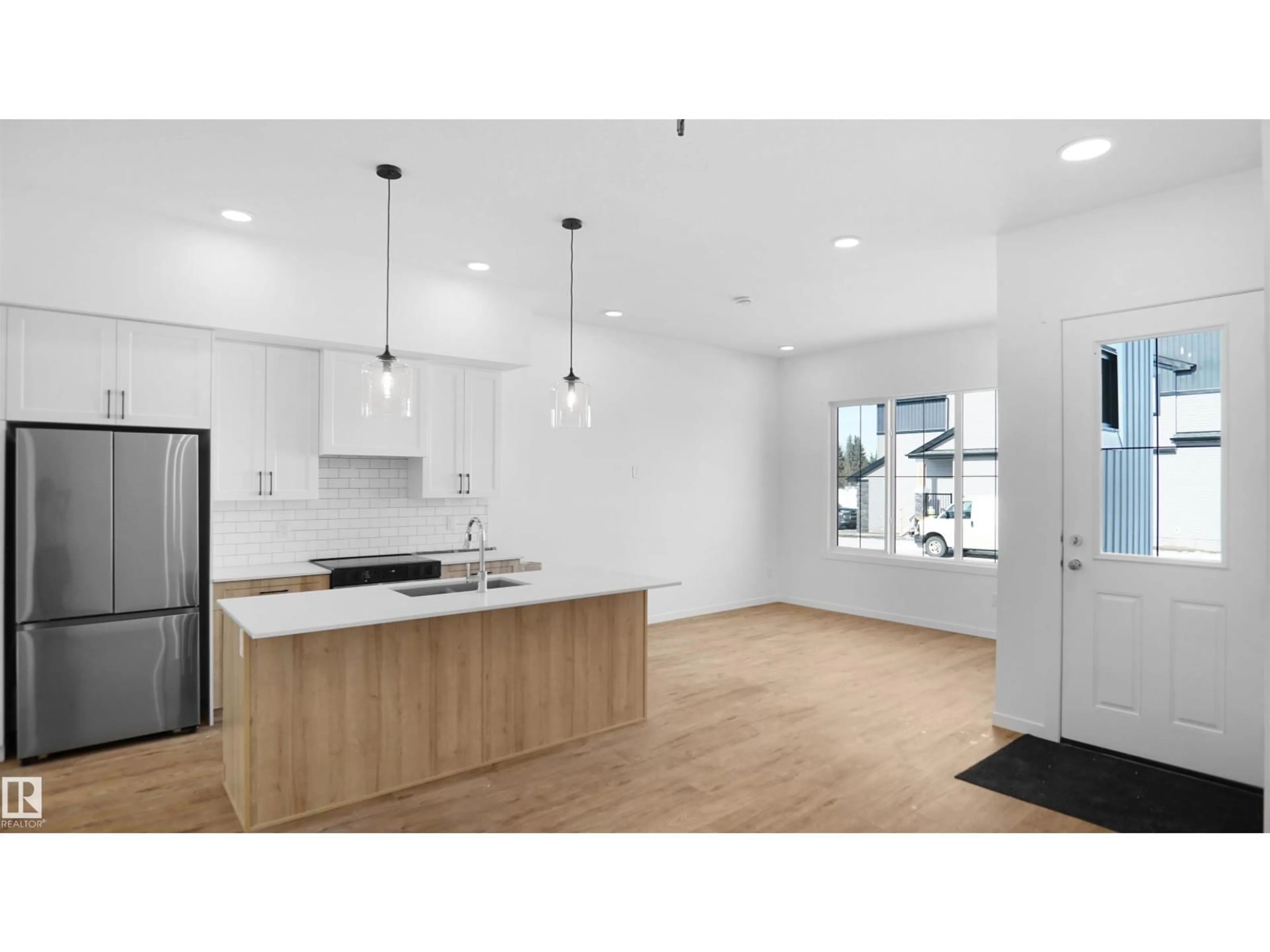 Open concept kitchen, wood/laminate floor for 20605 42 AV, Edmonton Alberta T6M0R8