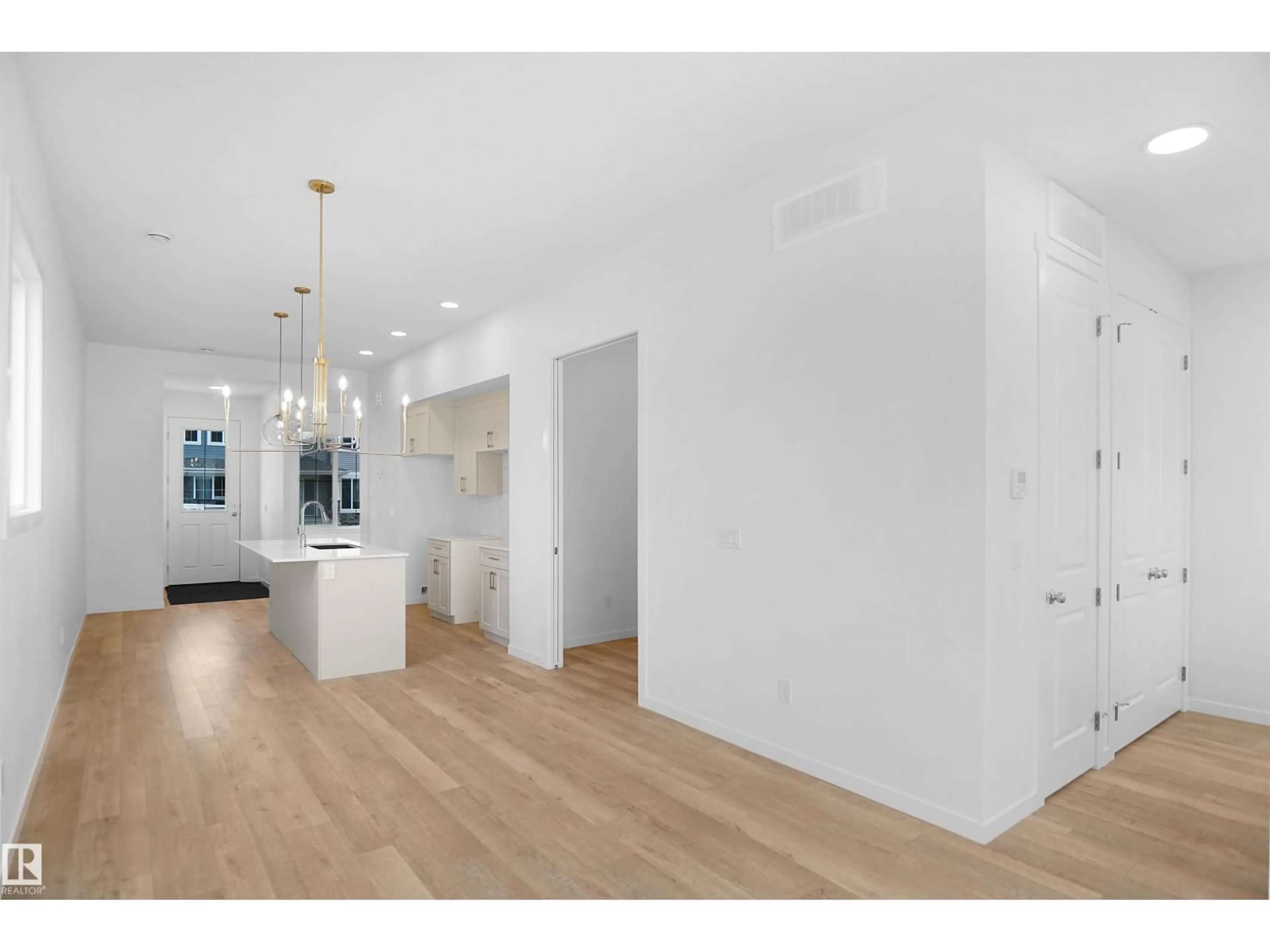 Open concept kitchen, wood/laminate floor for 20609 42 AV, Edmonton Alberta T6M0R8