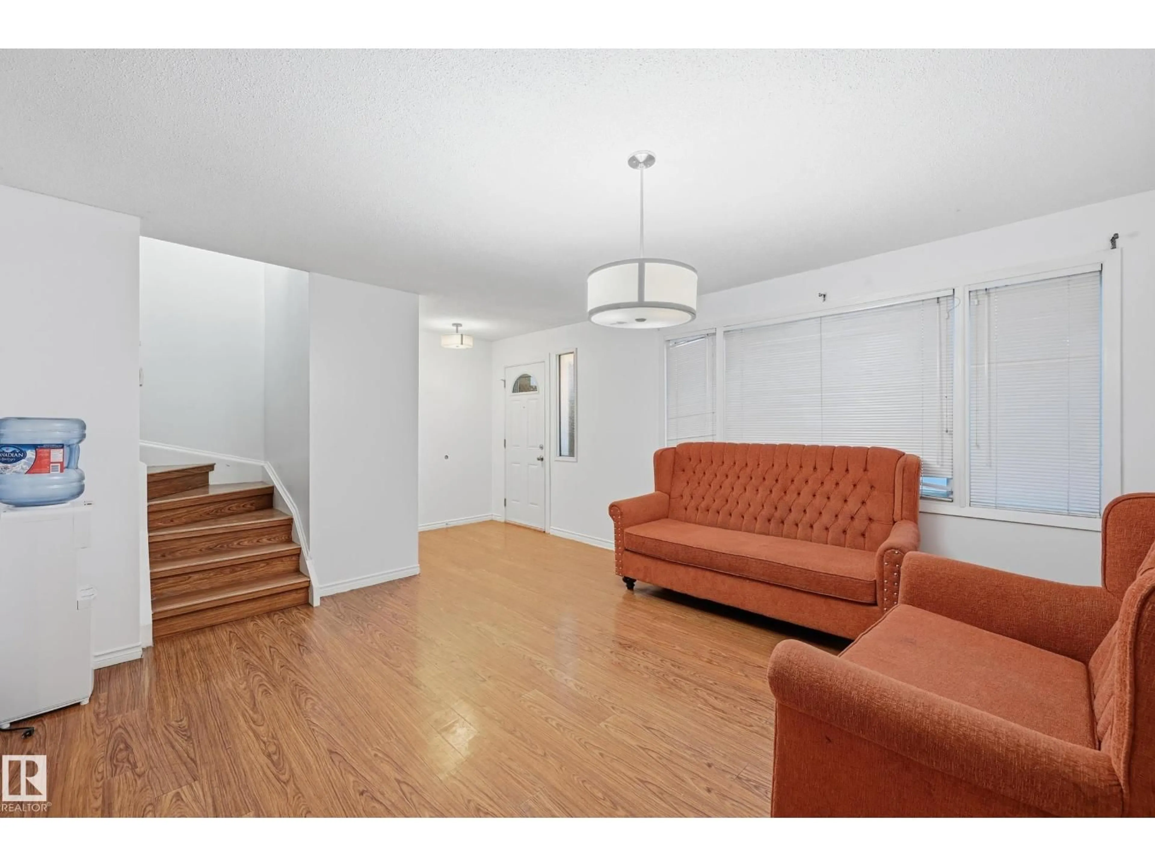 Living room with furniture, unknown for 10810 132 AV, Edmonton Alberta T5E0Z6