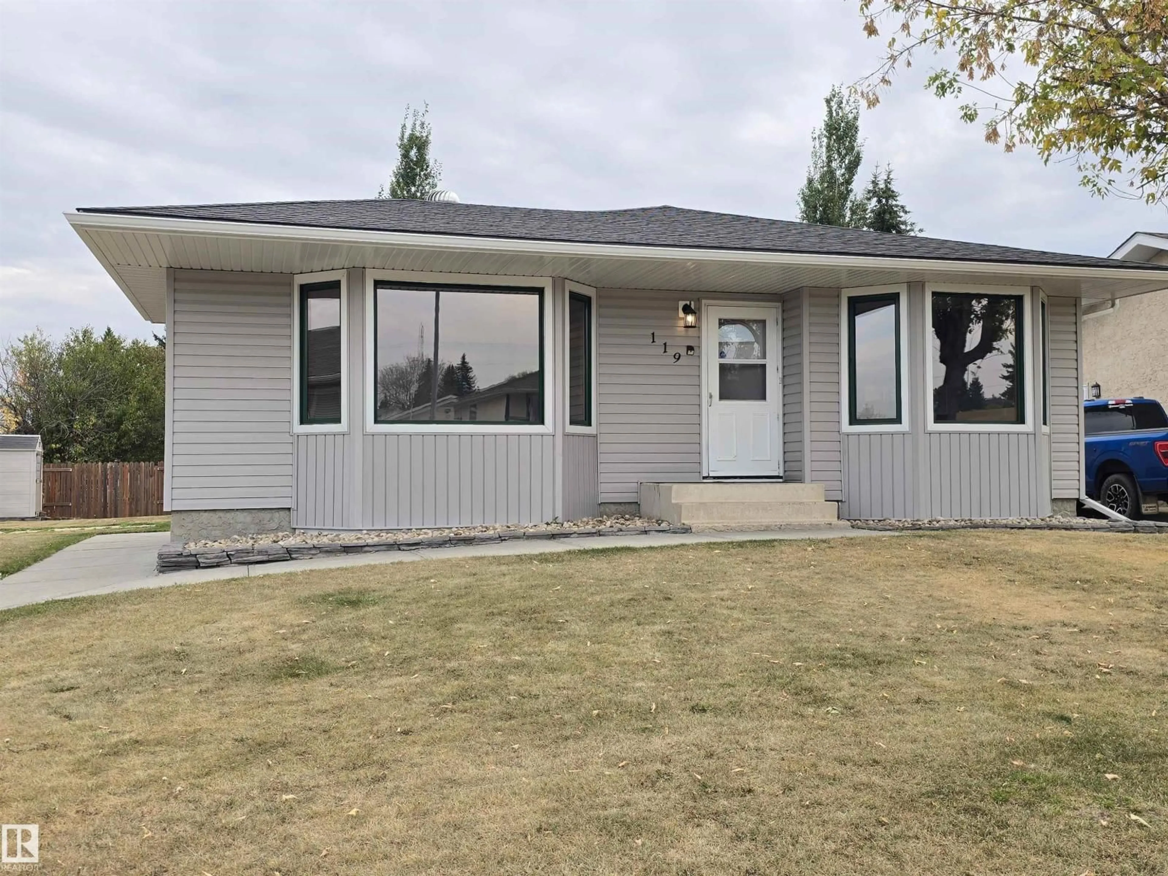 Home with vinyl exterior material, street for 119 DIAMOND DR, Millet Alberta T0C1Z0