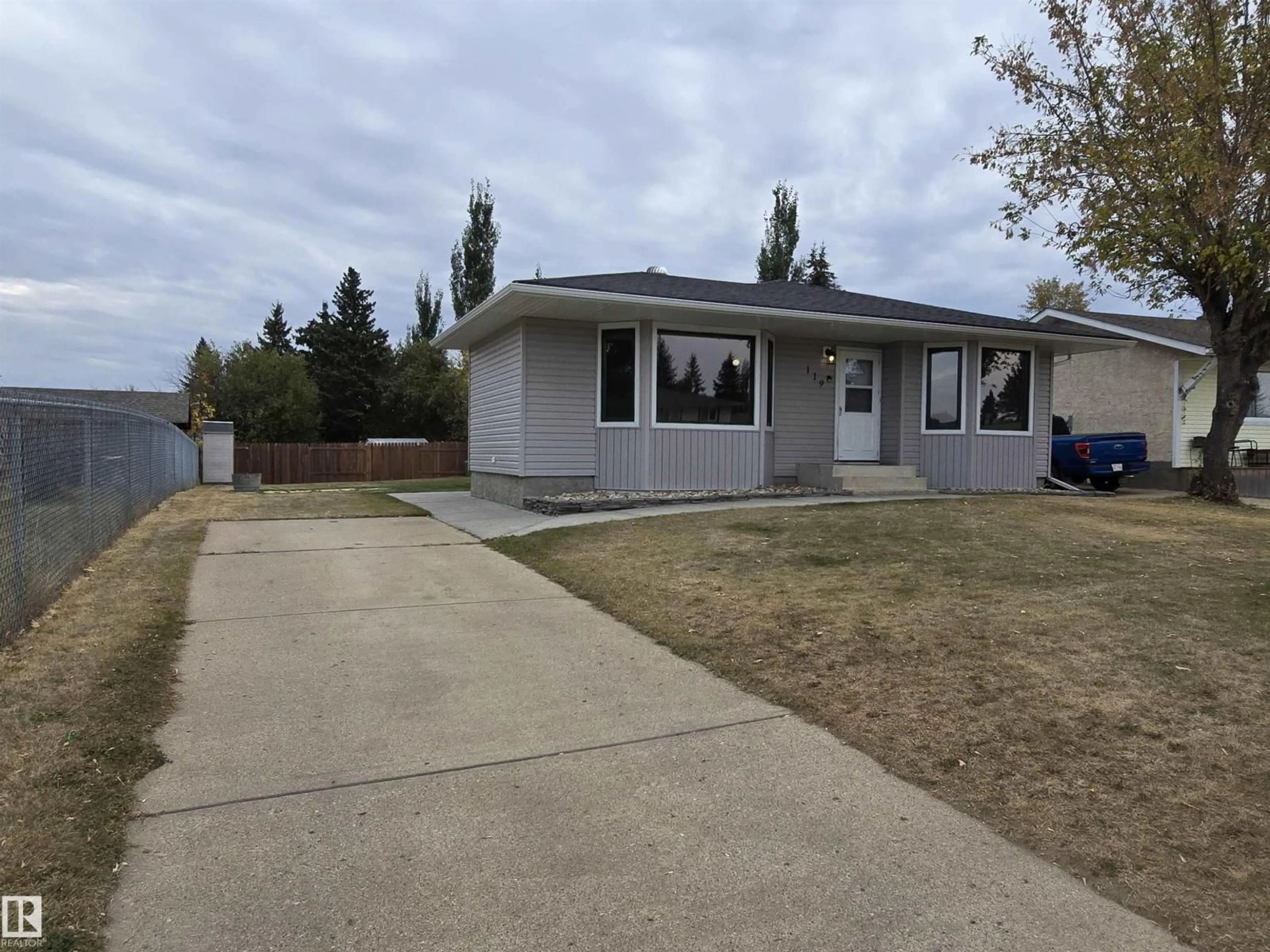 Home with vinyl exterior material, street for 119 DIAMOND DR, Millet Alberta T0C1Z0