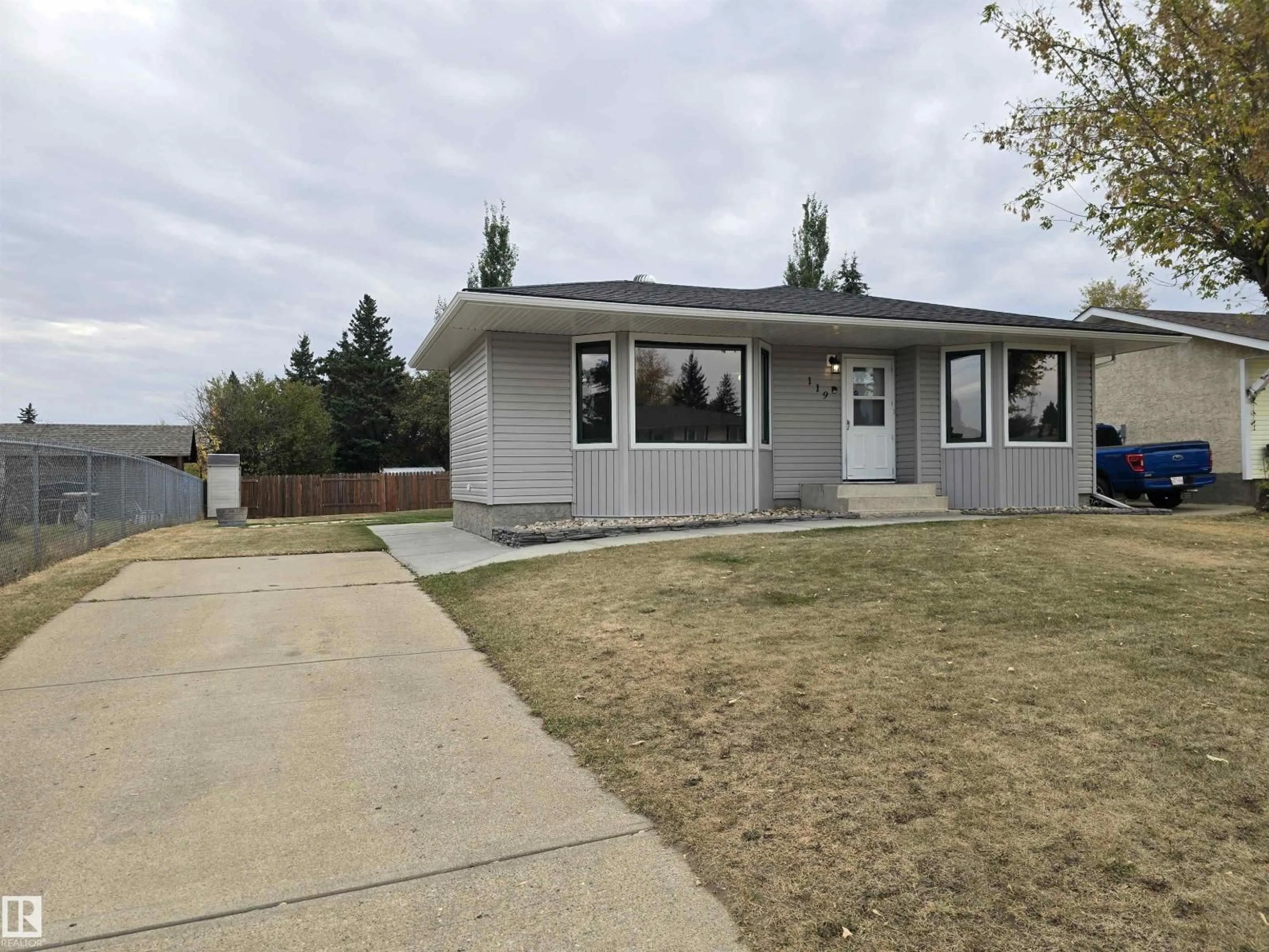 Home with vinyl exterior material, street for 119 DIAMOND DR, Millet Alberta T0C1Z0