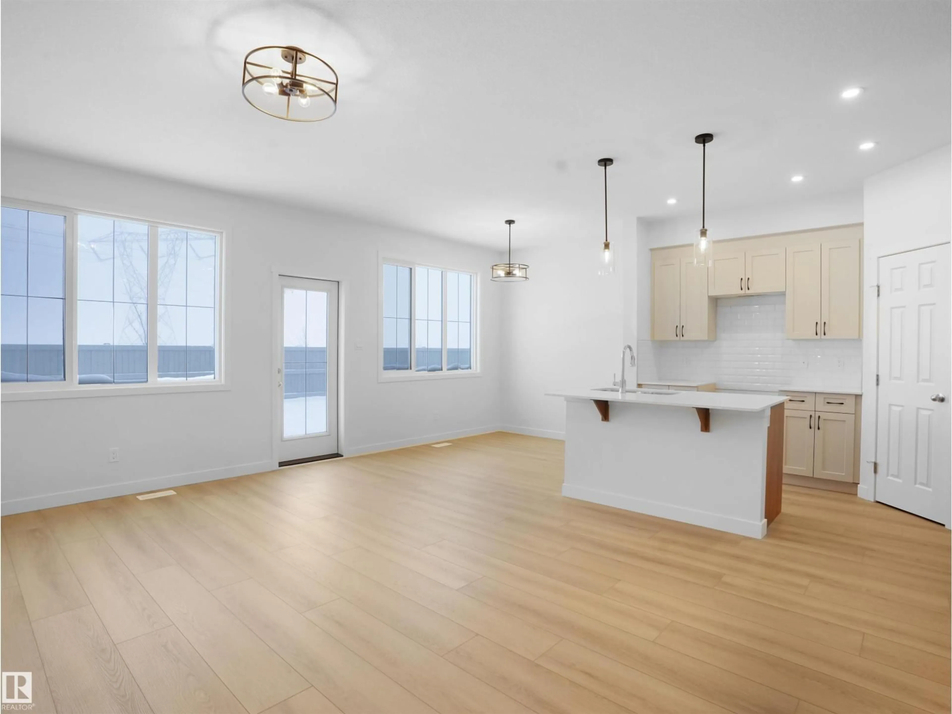 Open concept kitchen, wood/laminate floor for 9734 CARSON PL, Edmonton Alberta T6W5P9