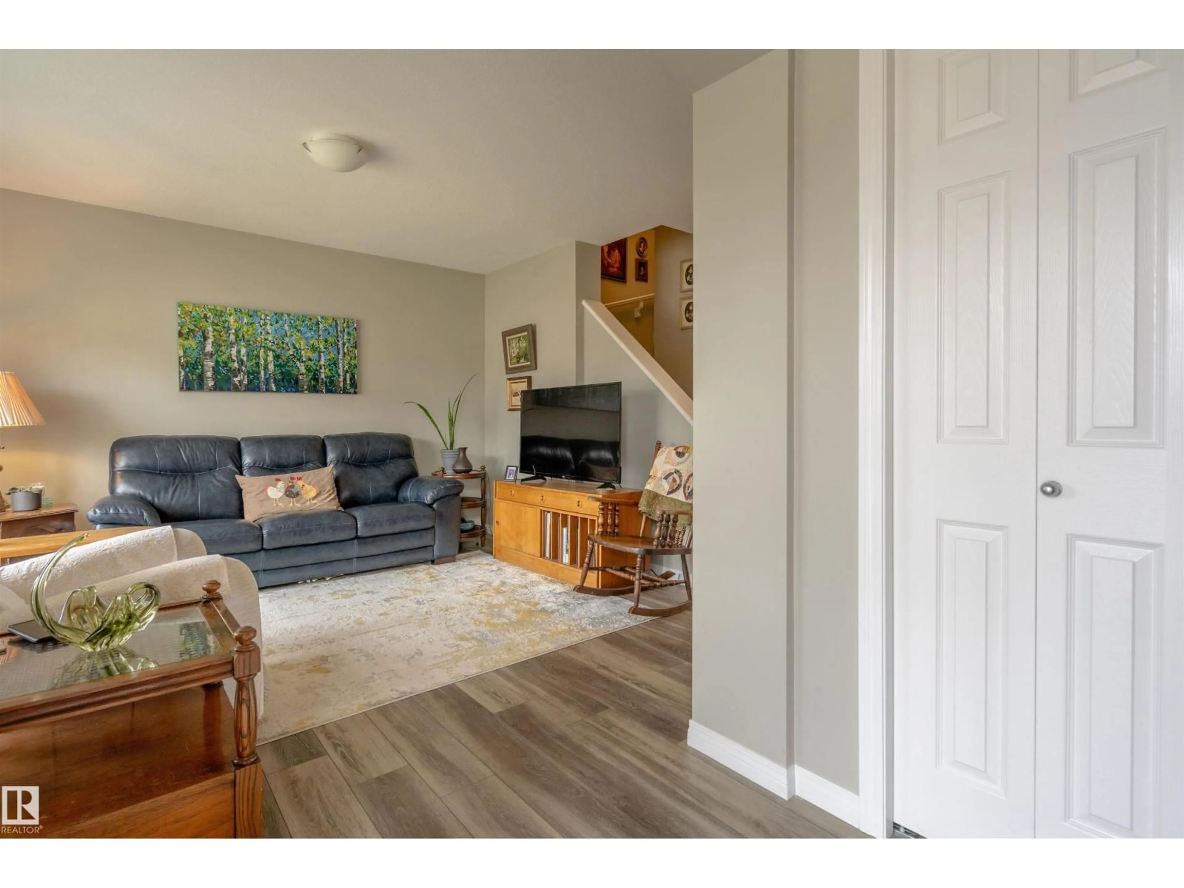 Living room with furniture, wood/laminate floor for 4437 38 ST, Beaumont Alberta T4X2X1