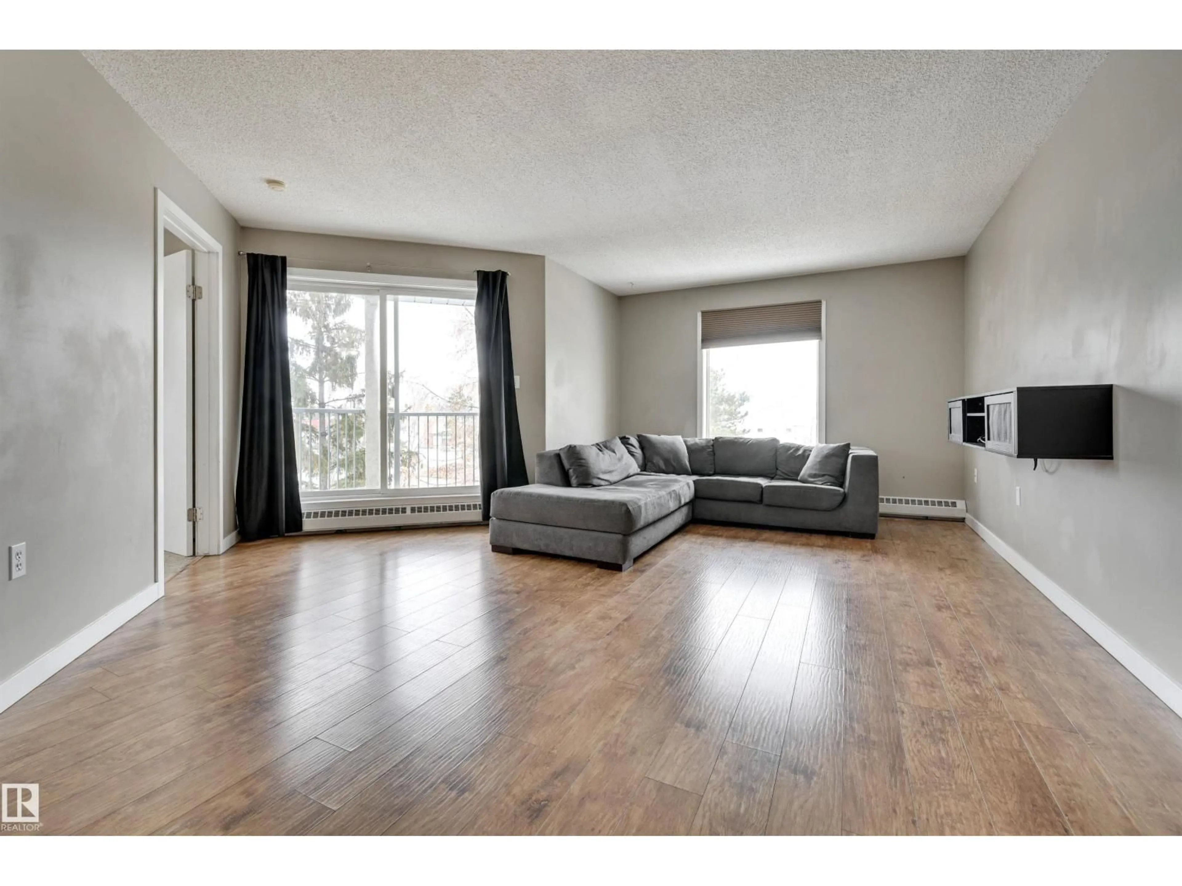 Living room with furniture, wood/laminate floor for #302 - 9620 174 ST NW, Edmonton Alberta T5T6B9