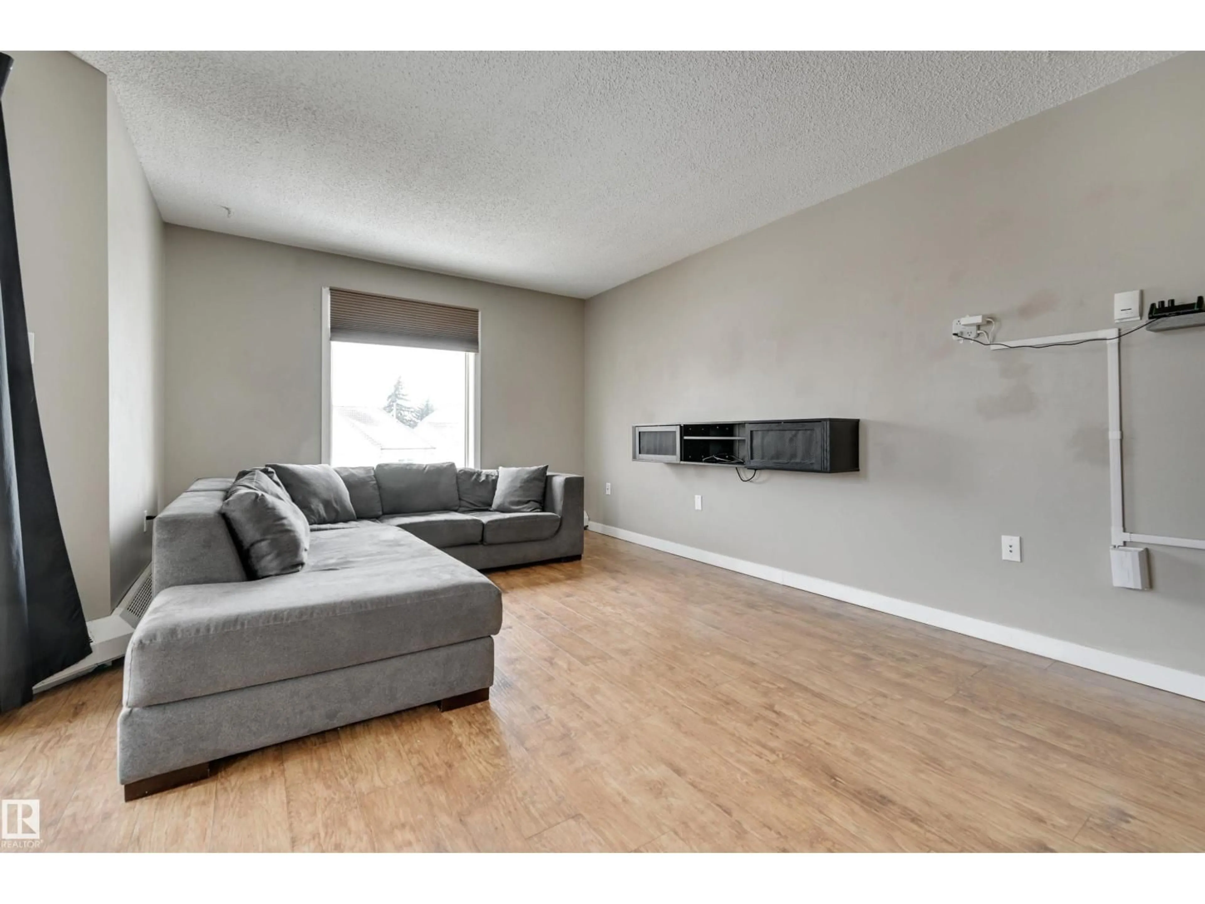 Living room with furniture, wood/laminate floor for #302 - 9620 174 ST NW, Edmonton Alberta T5T6B9