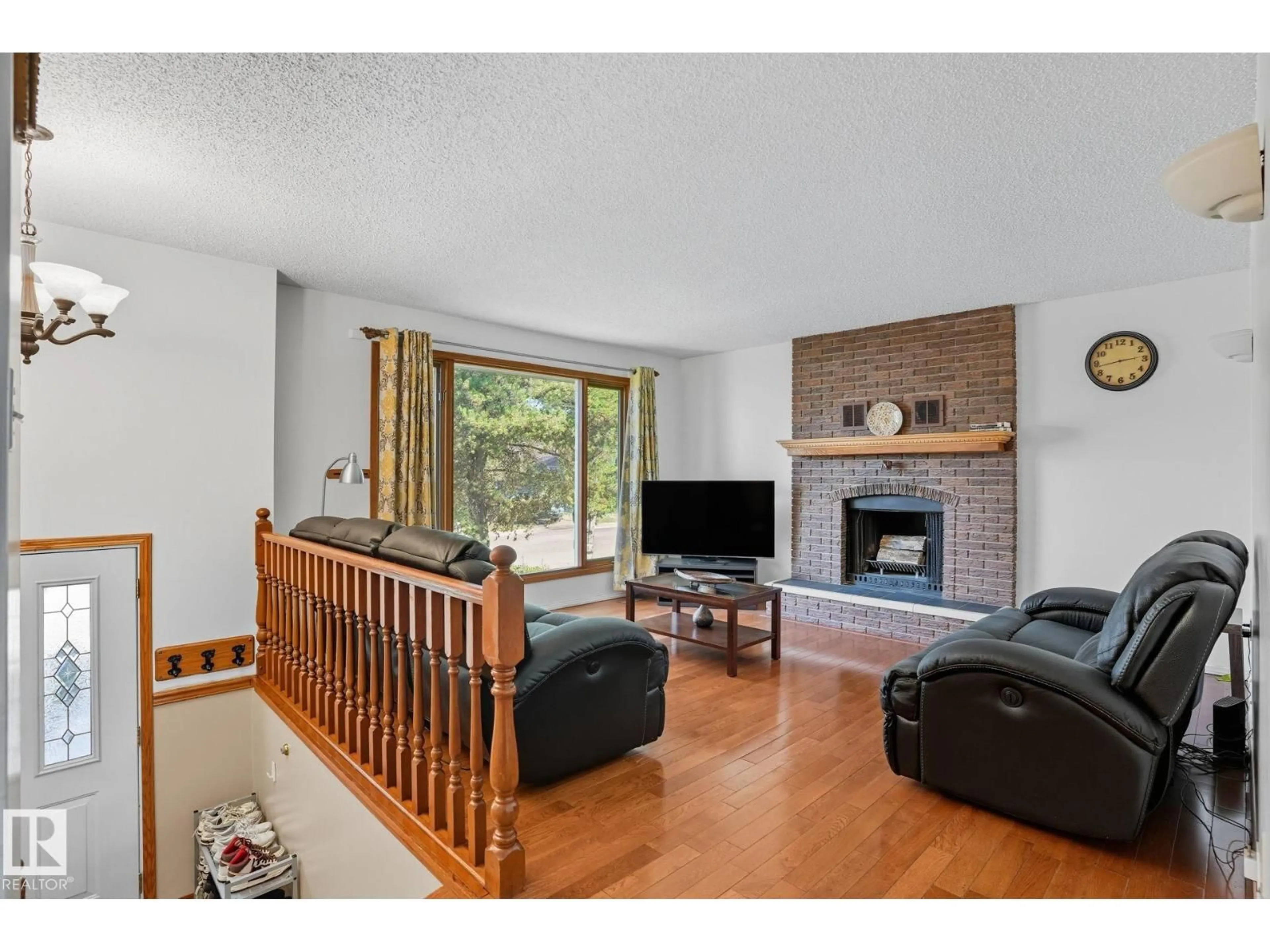 Living room with furniture, wood/laminate floor for 5508 54 ST, Beaumont Alberta T4X1A3