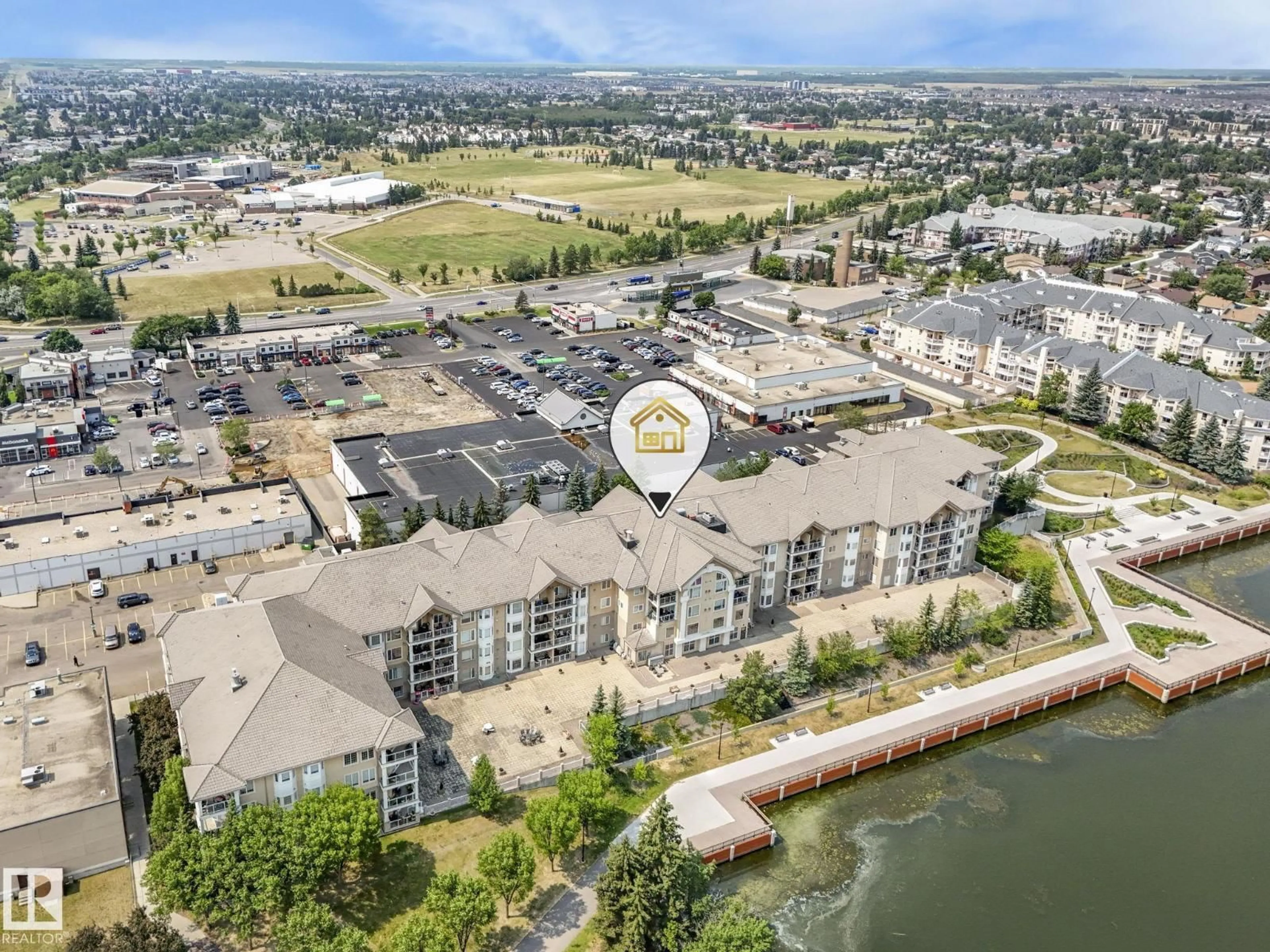 A pic from outside/outdoor area/front of a property/back of a property/a pic from drone, water/lake/river/ocean view for #208 - 11260 153 AV, Edmonton Alberta T6X6E7