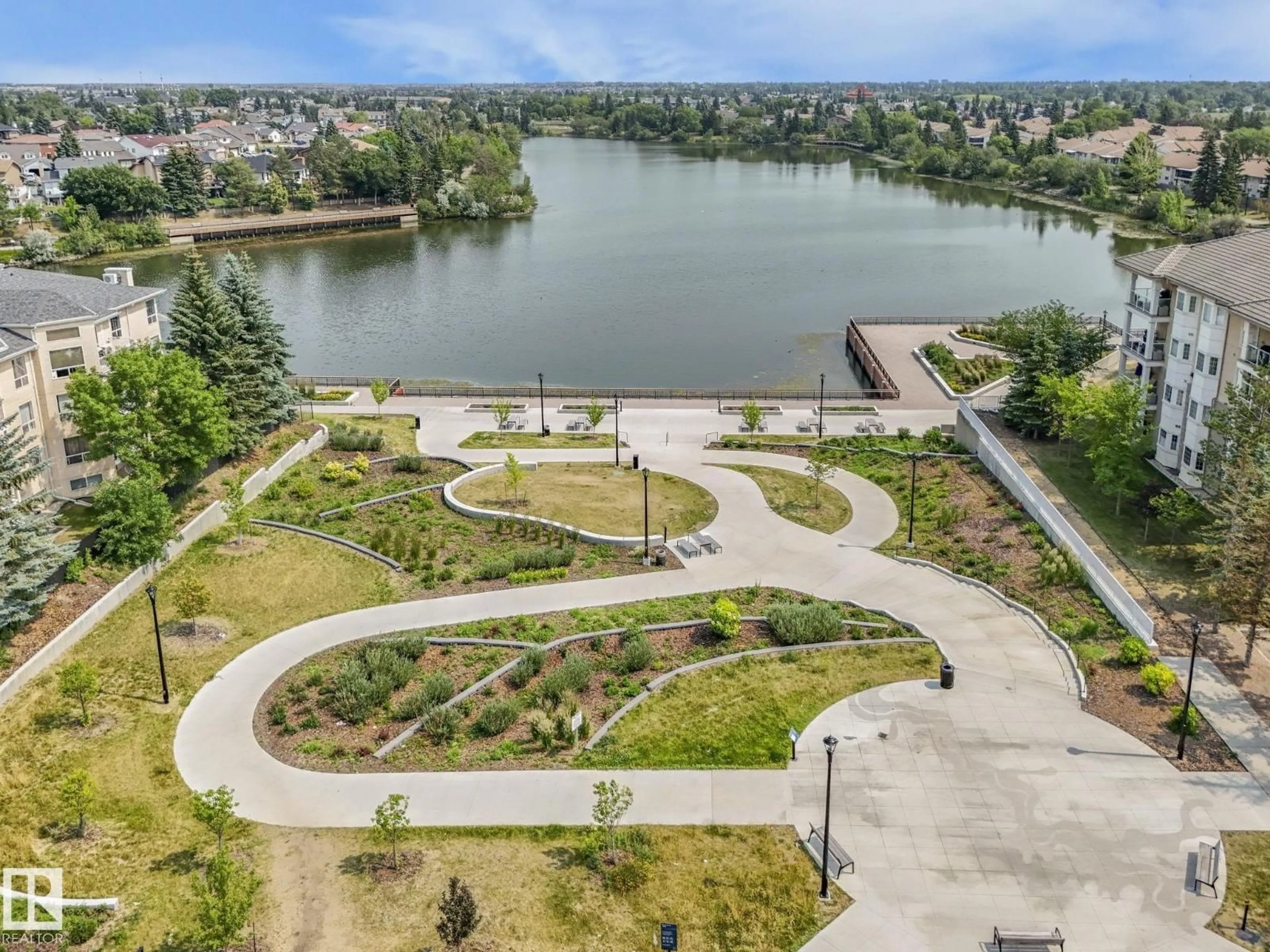 A pic from outside/outdoor area/front of a property/back of a property/a pic from drone, water/lake/river/ocean view for #208 - 11260 153 AV, Edmonton Alberta T6X6E7