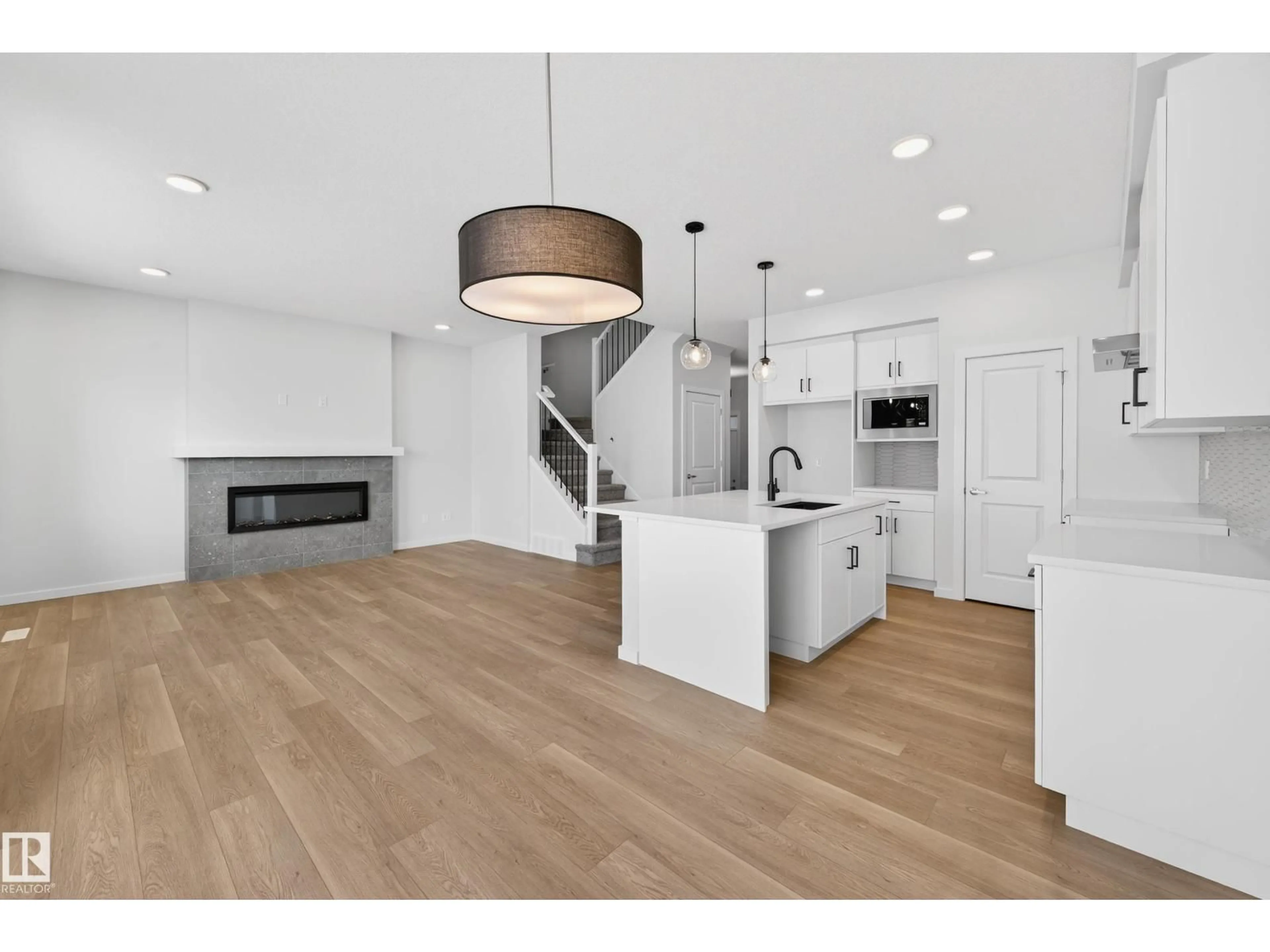 Open concept kitchen, wood/laminate floor for 5008 72 ST, Beaumont Alberta T4X3E6