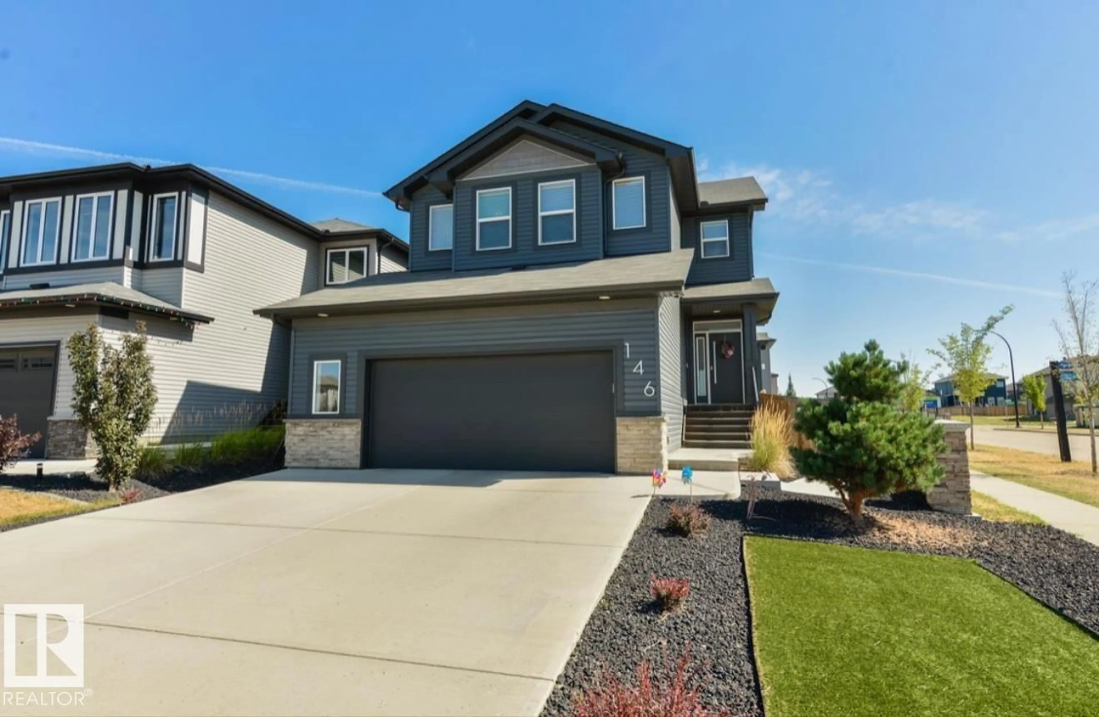 Home with vinyl exterior material, street for 146 CARAGANA WY, Fort Saskatchewan Alberta T8L0P4
