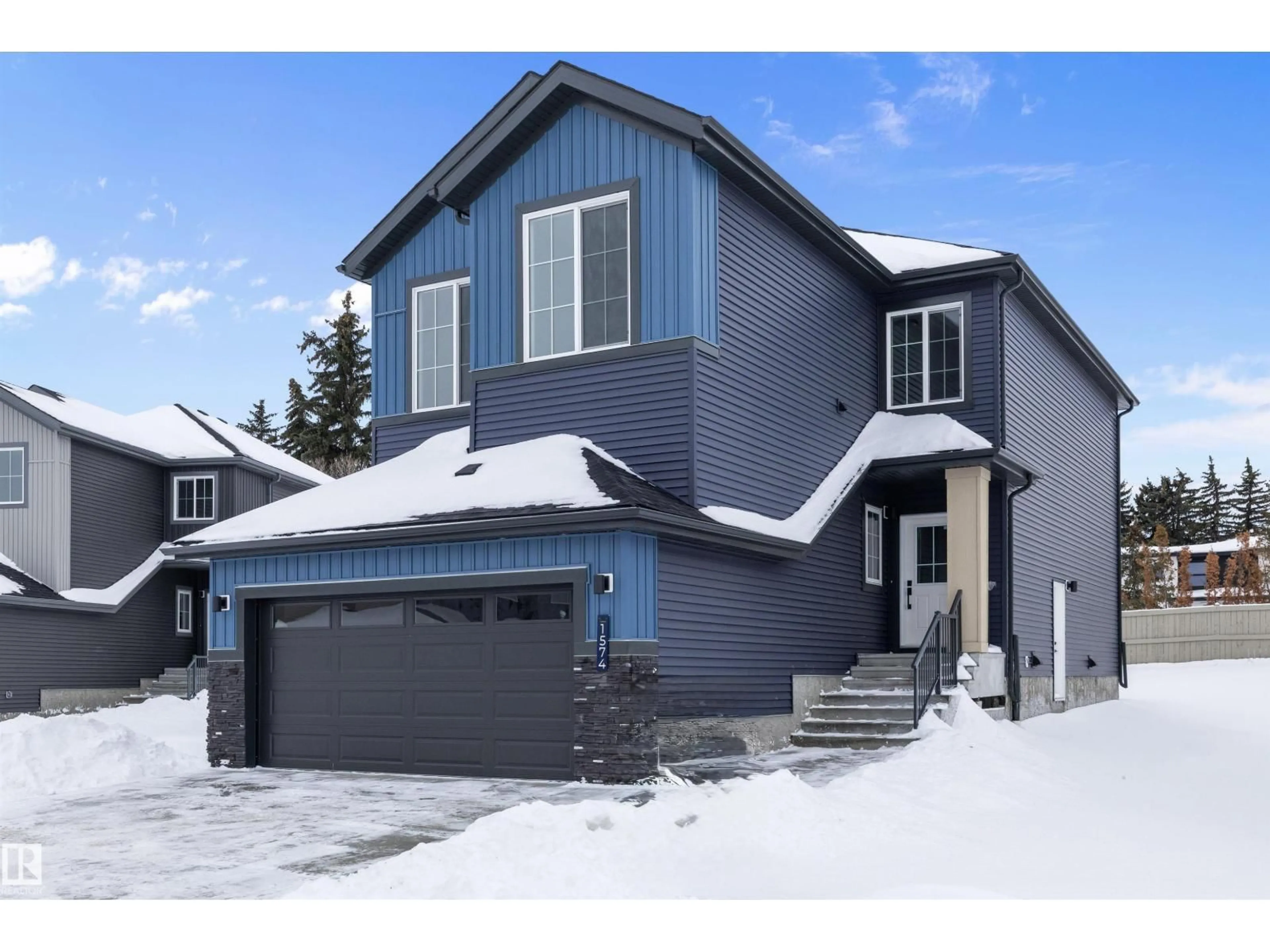Home with vinyl exterior material, street for NW - 1574 SISKIN LINK, Edmonton Alberta T5S0V1