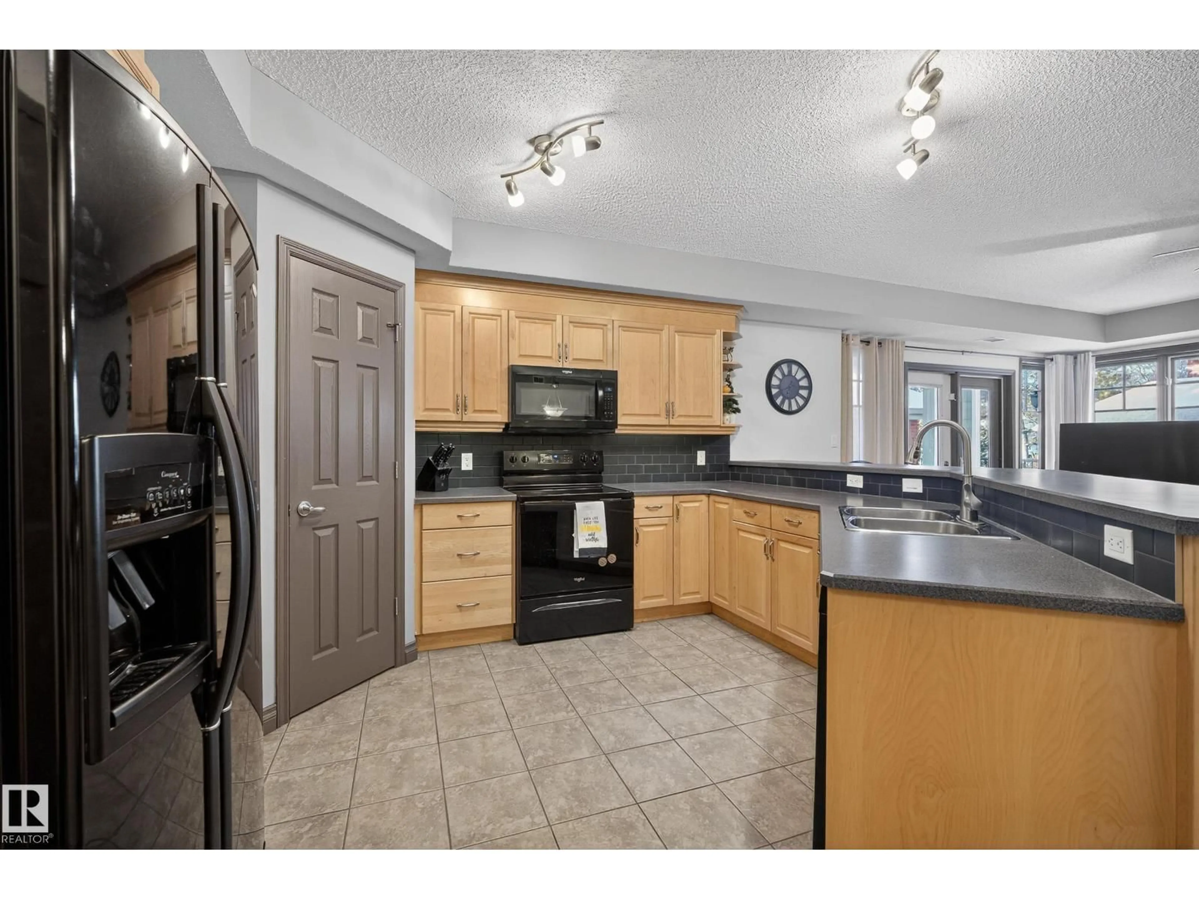 Open concept kitchen, ceramic/tile floor for #102 - 9803 96A ST, Edmonton Alberta T6A4A5