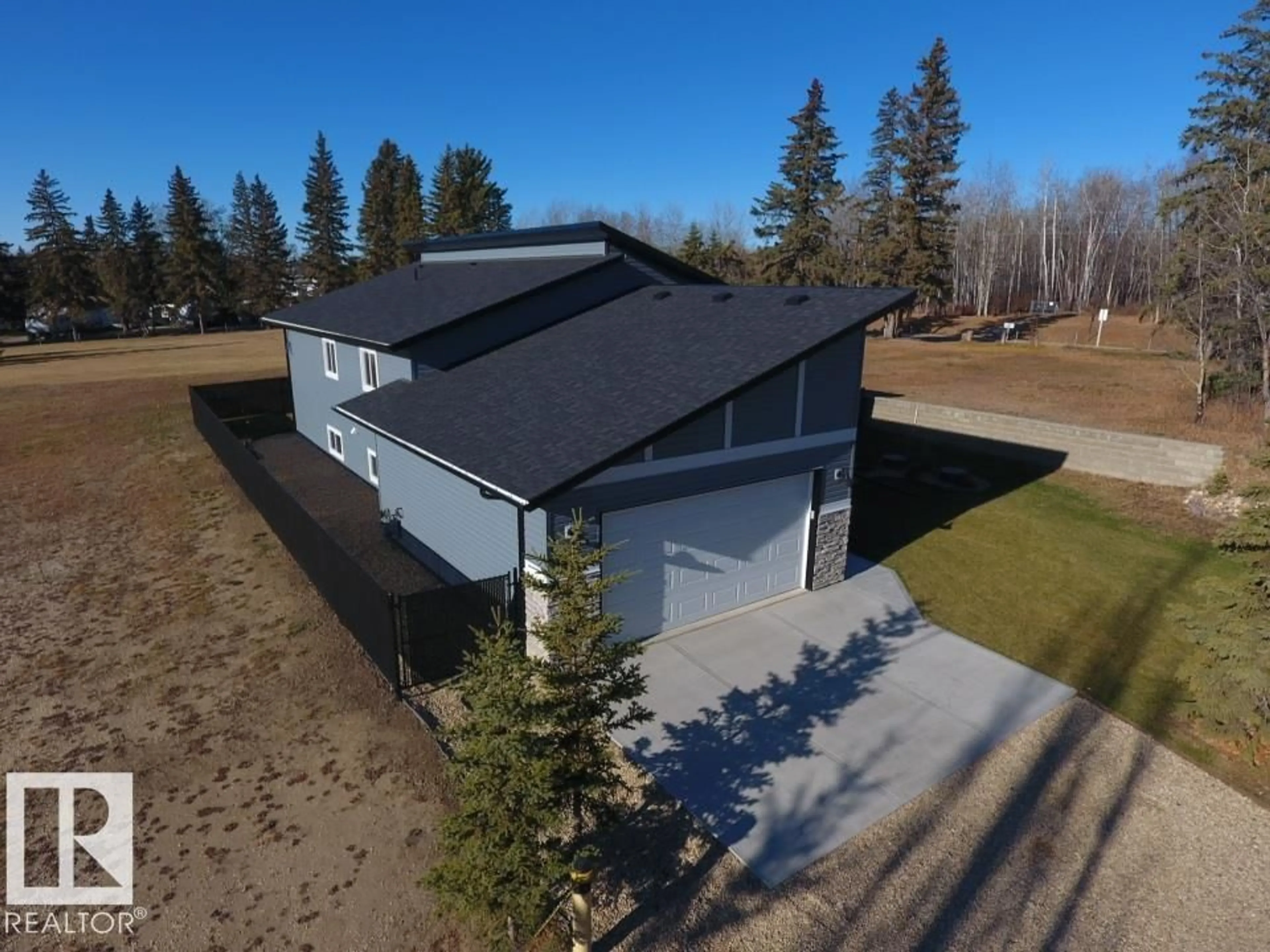 A pic from outside/outdoor area/front of a property/back of a property/a pic from drone, building for 102 1 ST, Rural Lac Ste. Anne County Alberta T0E1A0
