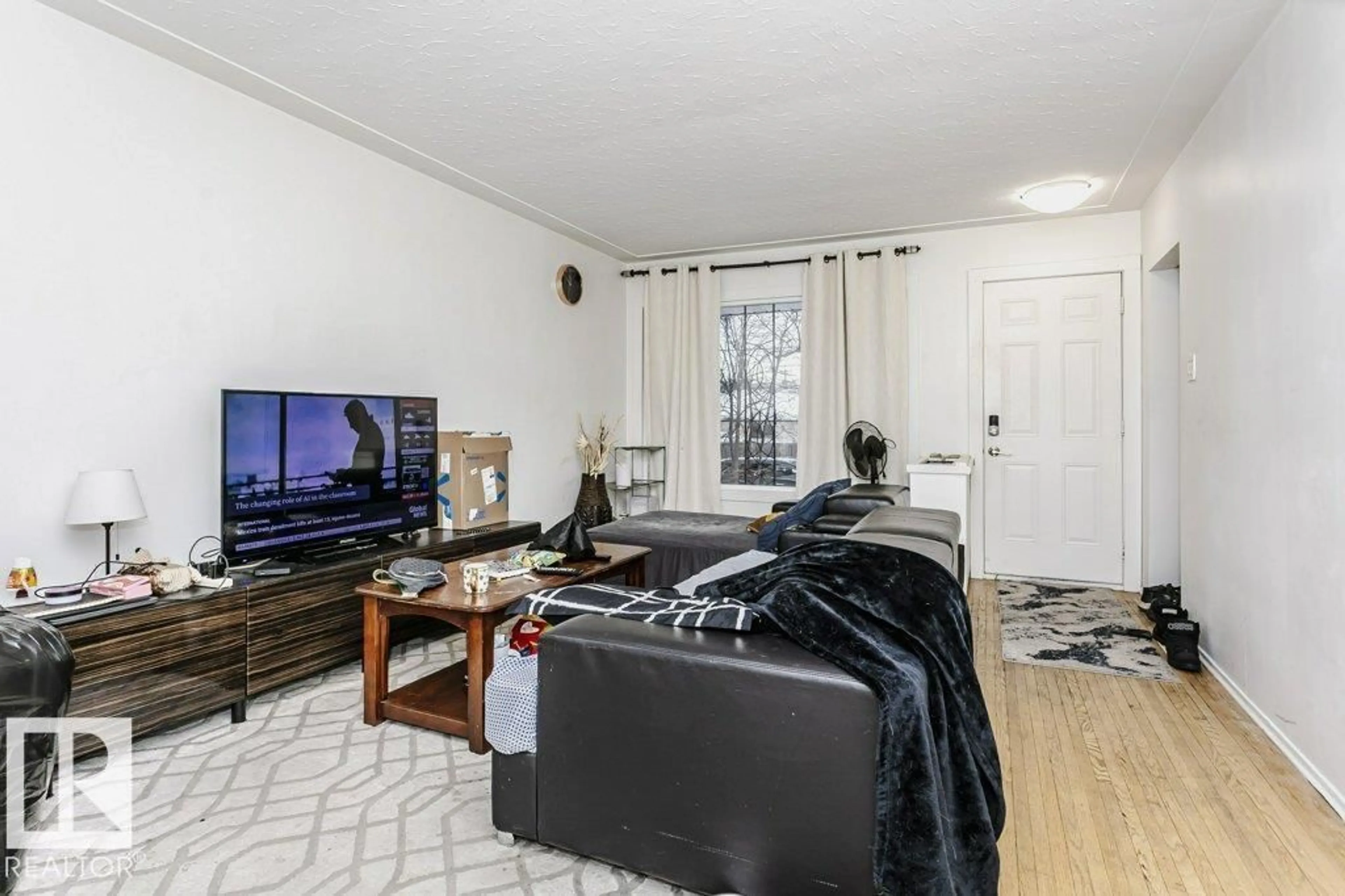 Living room with furniture, unknown for 9324 120 AV, Edmonton Alberta T5G0R6