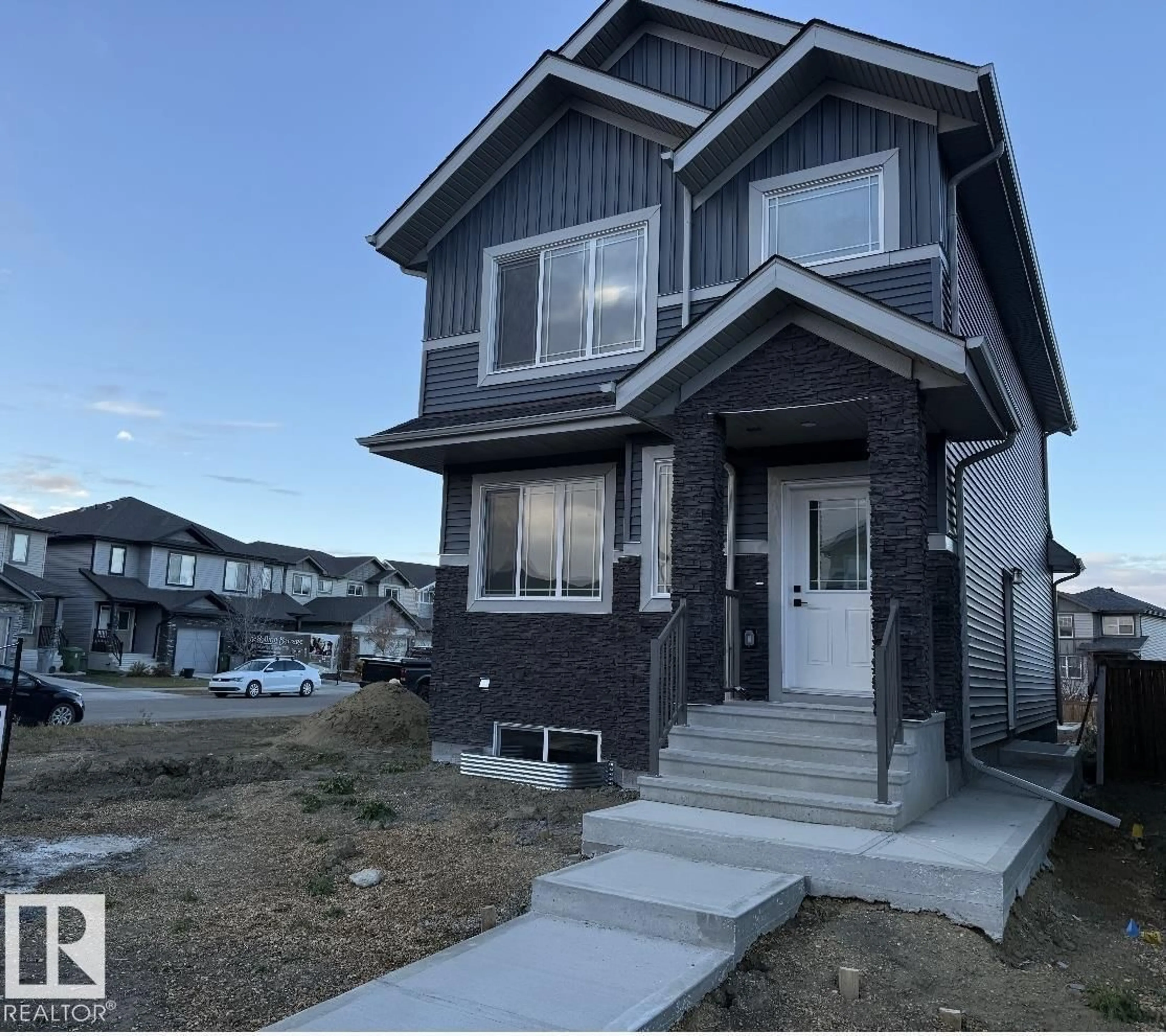 Home with vinyl exterior material, street for 9824 106 AV, Morinville Alberta T8R2P1