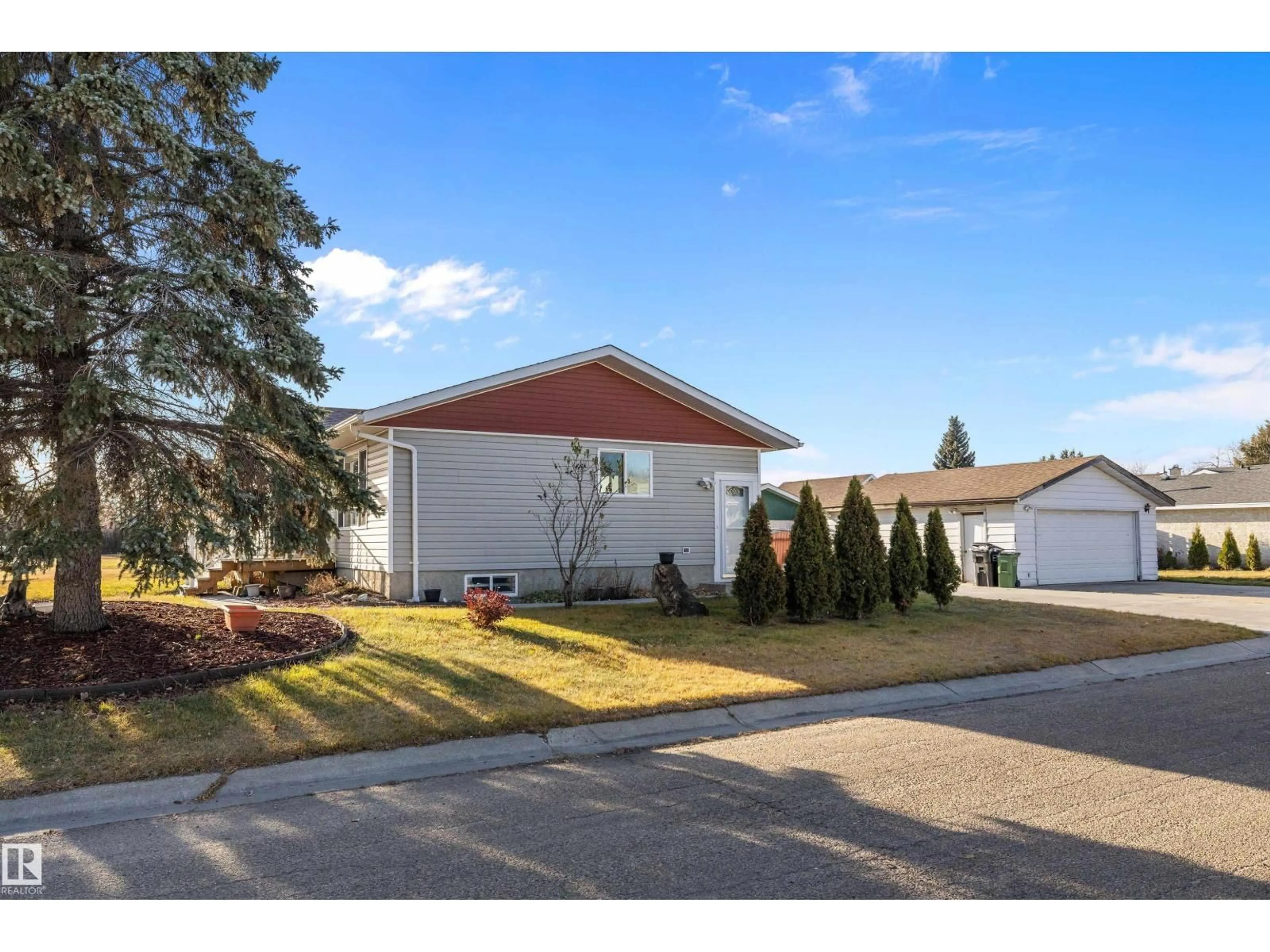 Home with vinyl exterior material, street for 14736 122 ST, Edmonton Alberta T5X1V9