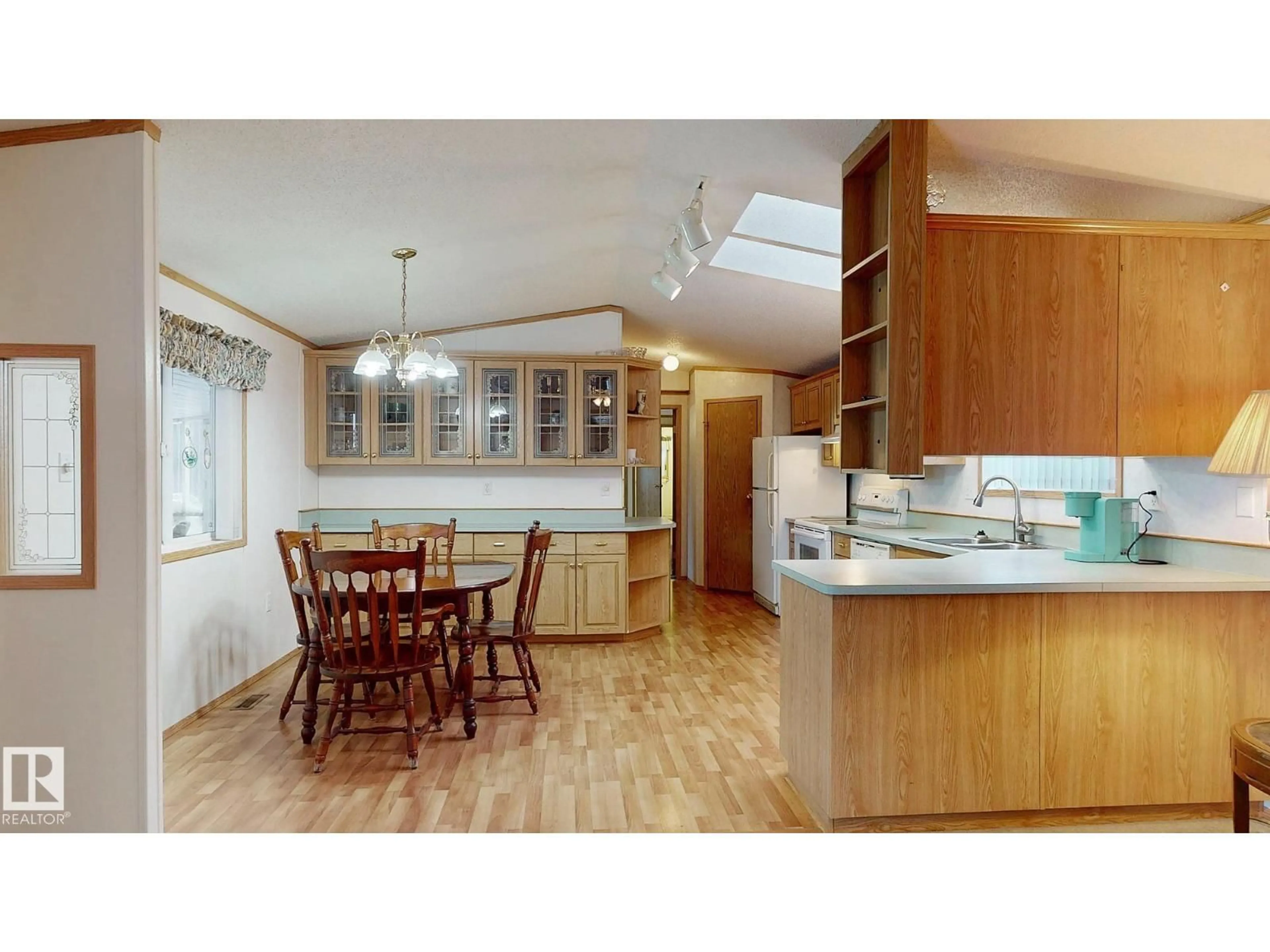 Open concept kitchen, wood/laminate floor for 2925 LAKEWOOD DR, Edmonton Alberta T5S1T7