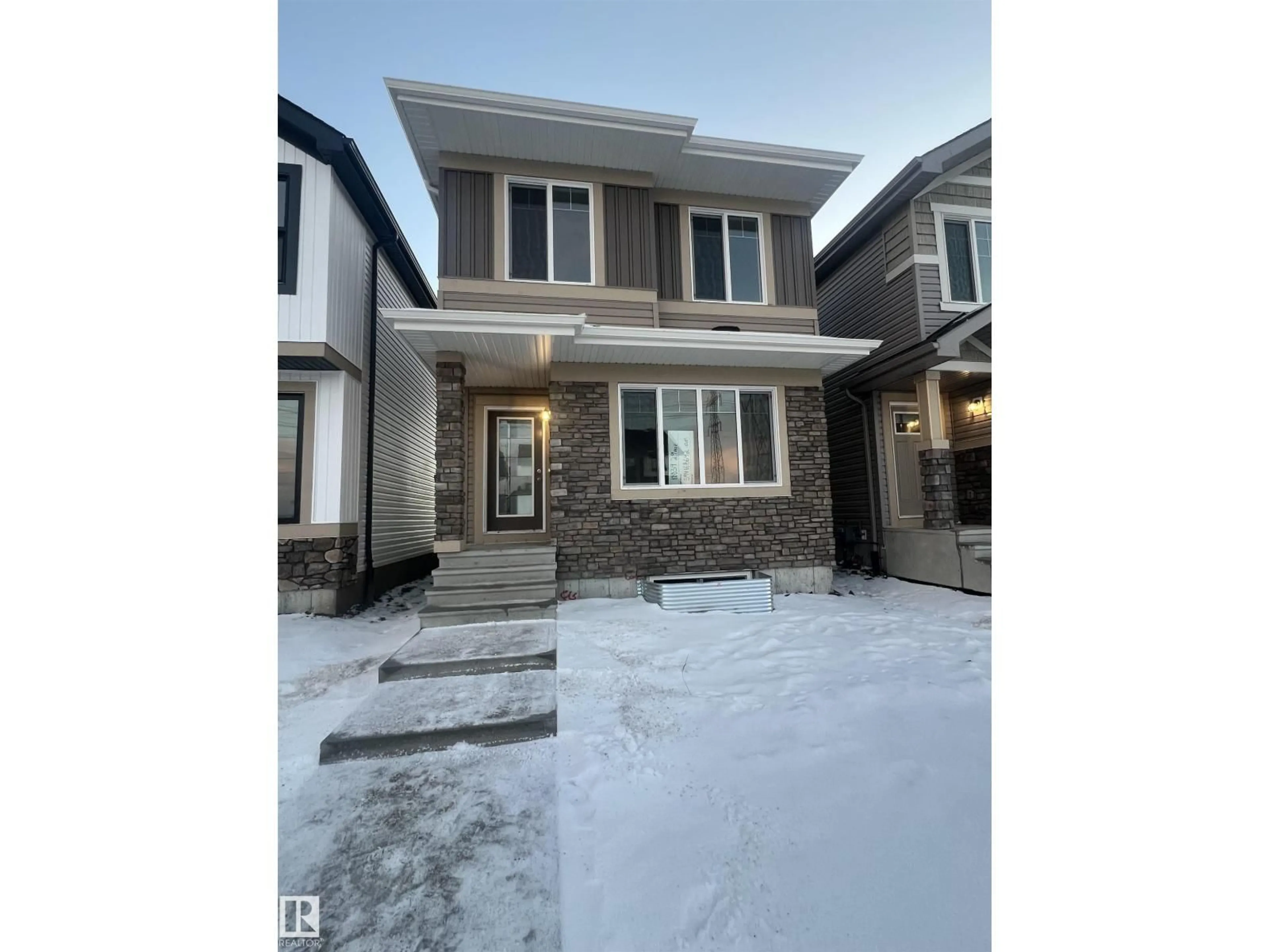 Home with brick exterior material, street for NW - 18839 29 AV, Edmonton Alberta T6M3C4