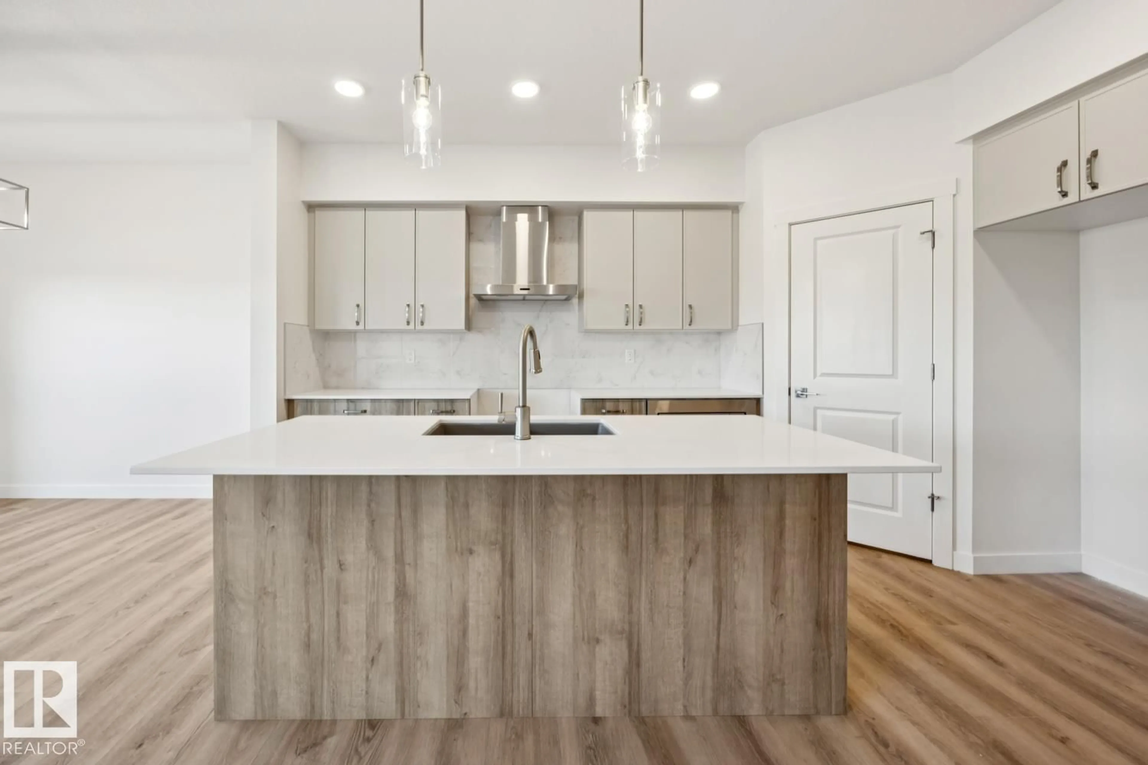 Open concept kitchen, wood/laminate floor for NW - 2828 191 ST, Edmonton Alberta T6M3C3