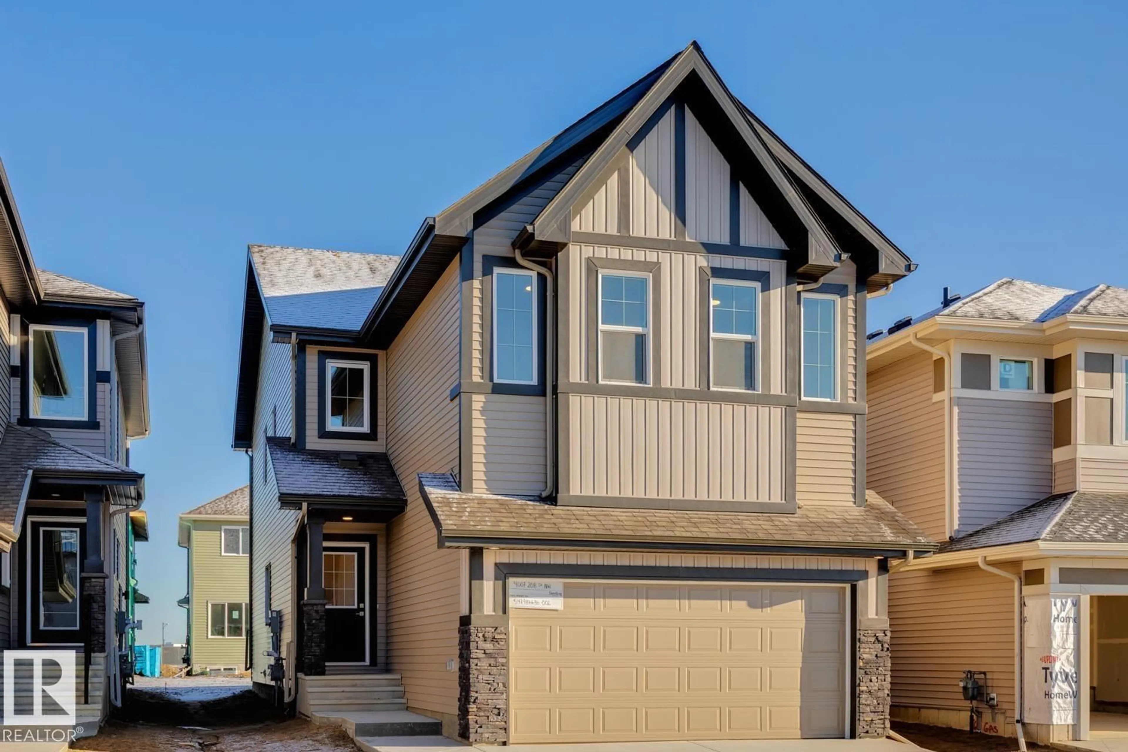 Home with vinyl exterior material, street for 4007 208 STREET, Edmonton Alberta T6M3E4