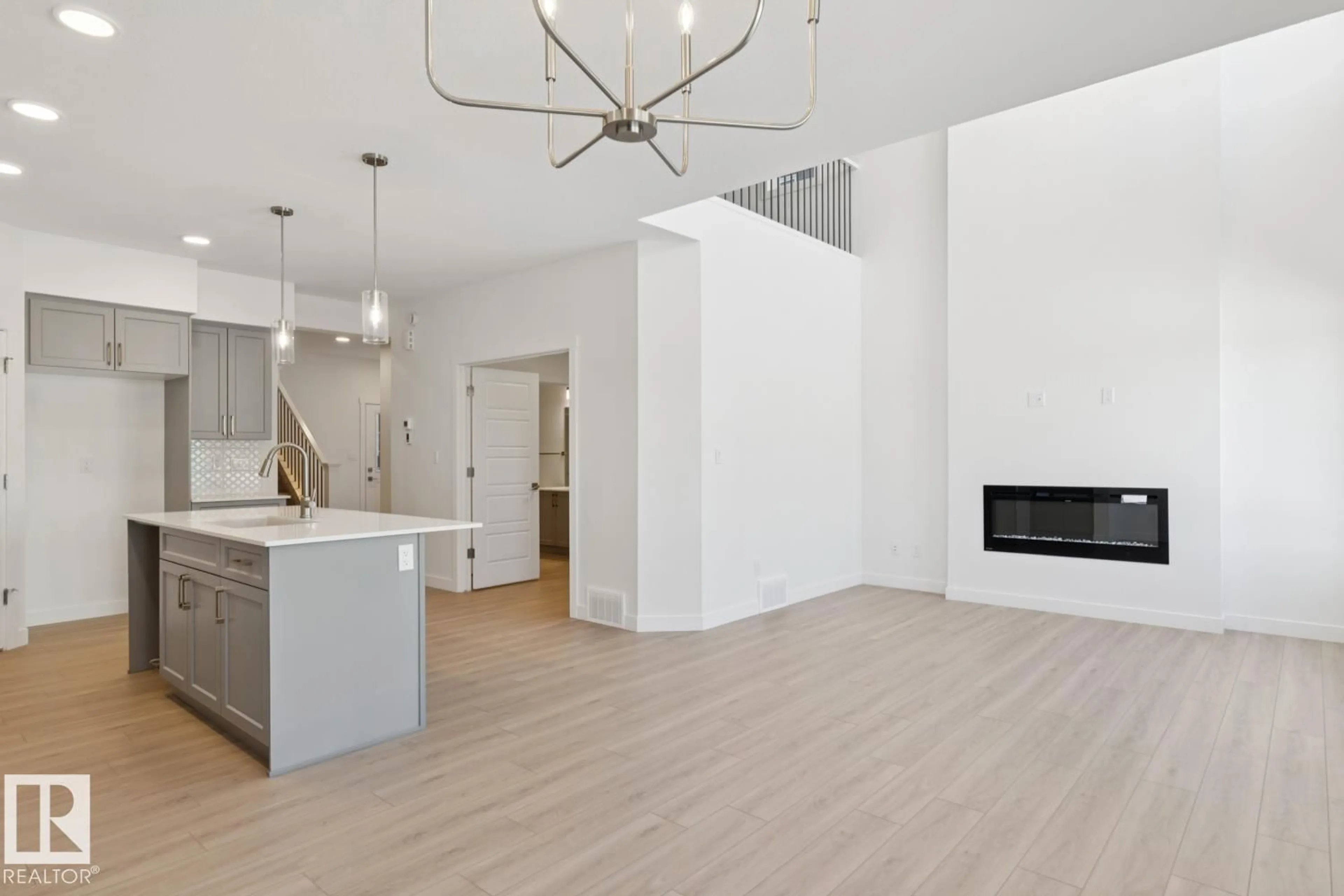 Open concept kitchen, wood/laminate floor for 4007 208 STREET, Edmonton Alberta T6M3E4