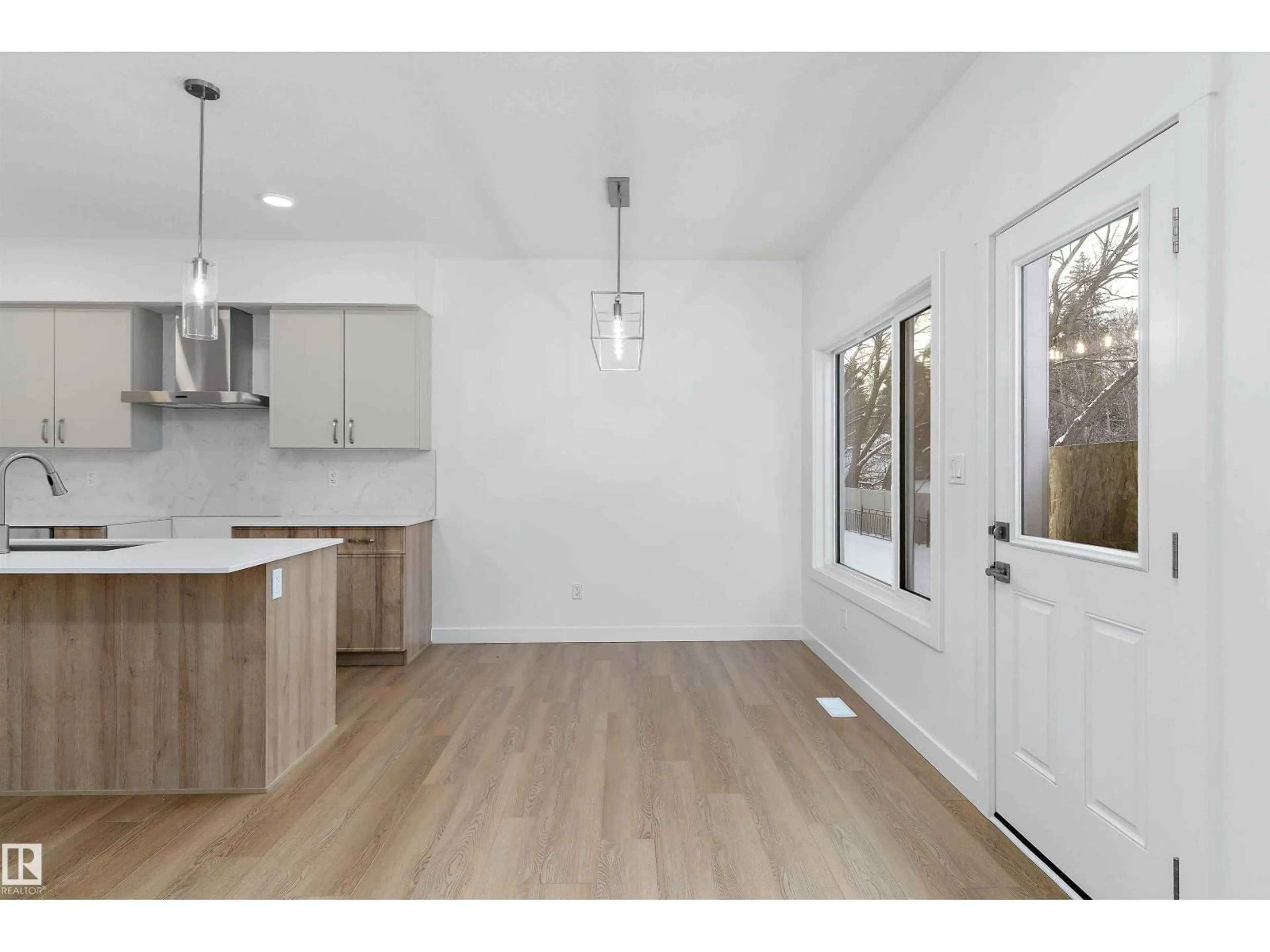 Open concept kitchen, wood/laminate floor for NW - 4232 208 ST, Edmonton Alberta T6M0N9