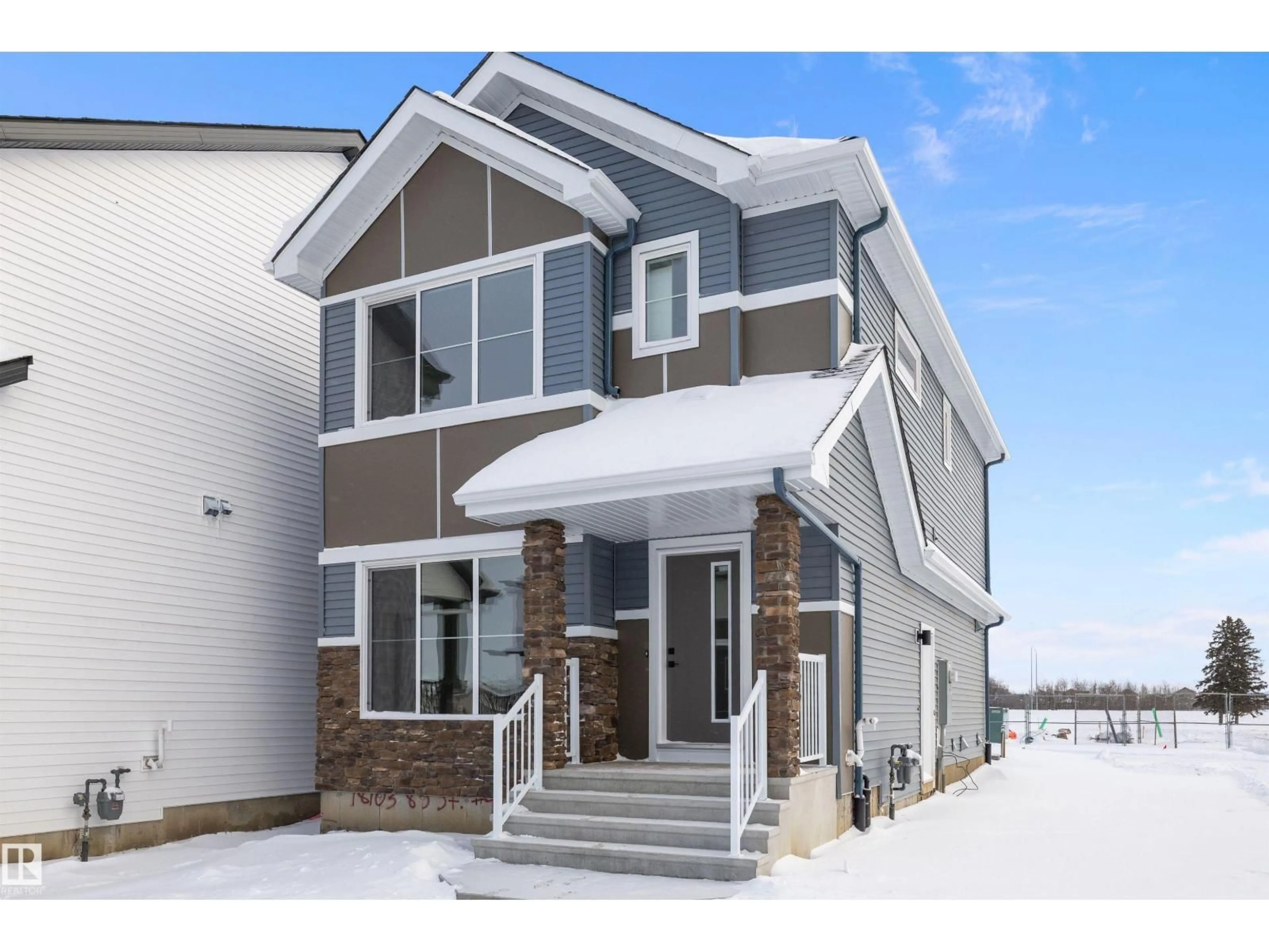 Home with vinyl exterior material, street for 18103 85 ST NW, Edmonton Alberta T5Z0G6
