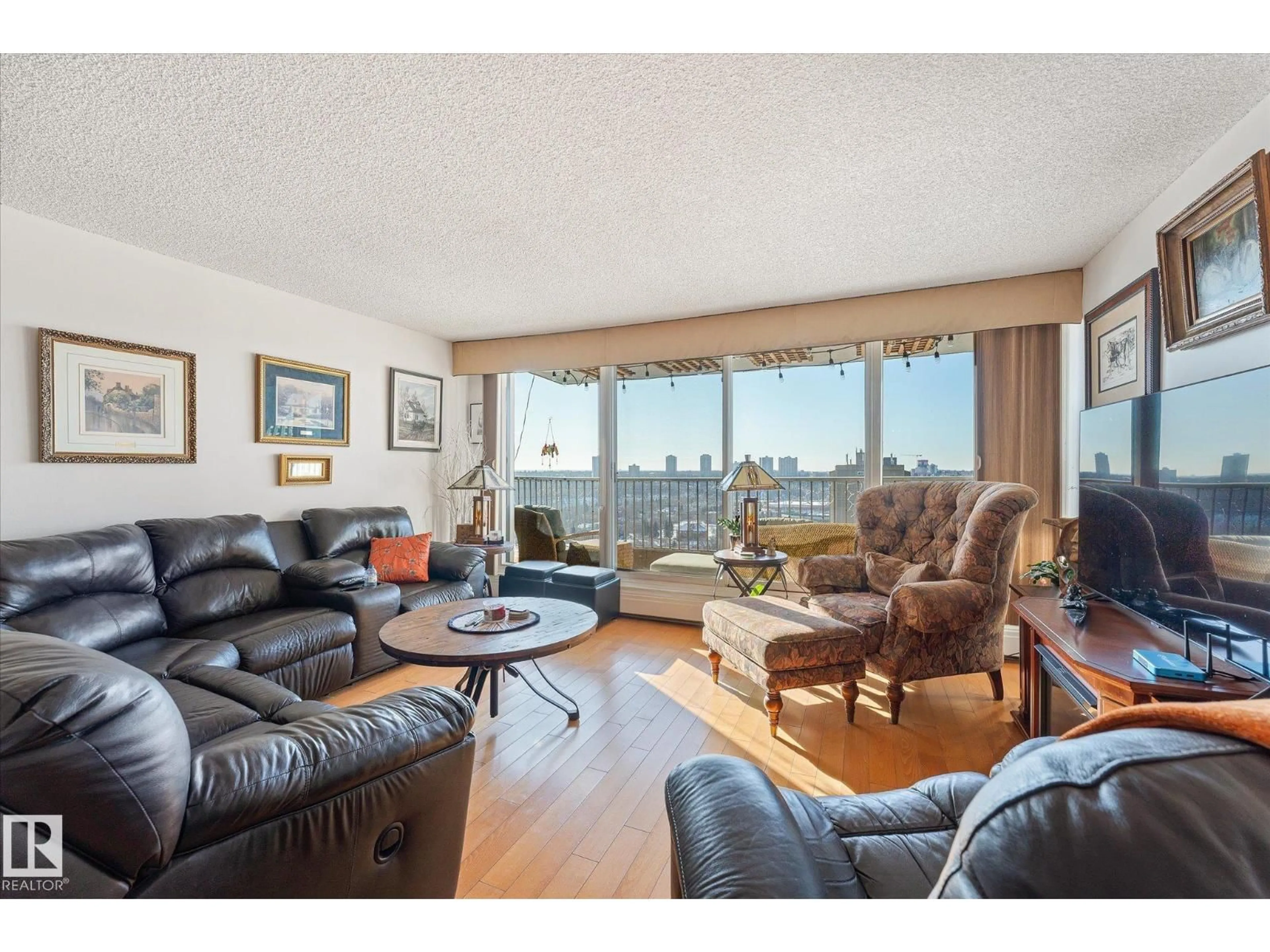 Living room with furniture, wood/laminate floor for NW - 1002 9923 103 ST, Edmonton Alberta T5K2J3