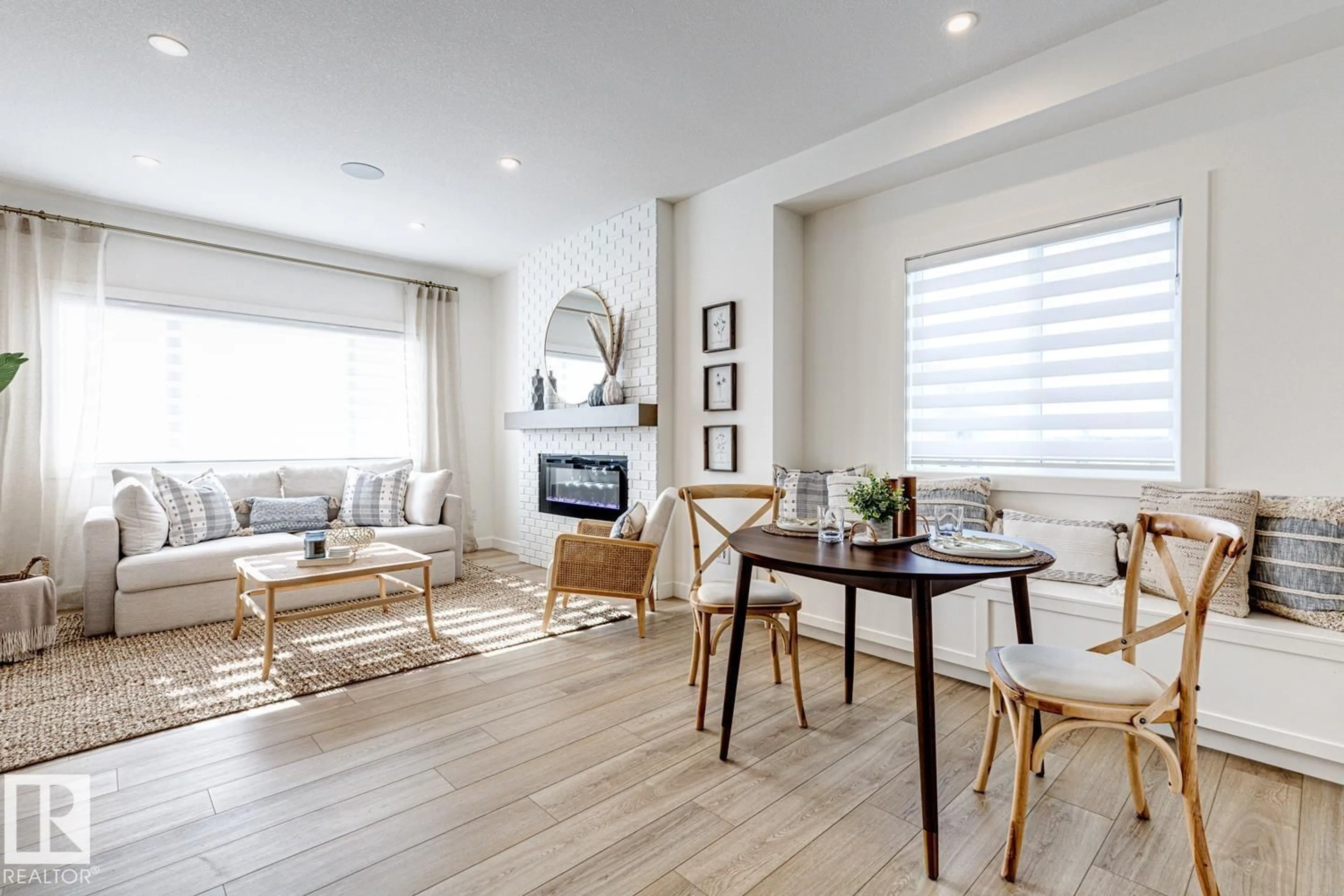 Living room with furniture, wood/laminate floor for 301 JUNIPER CV, Leduc Alberta T9E1S7
