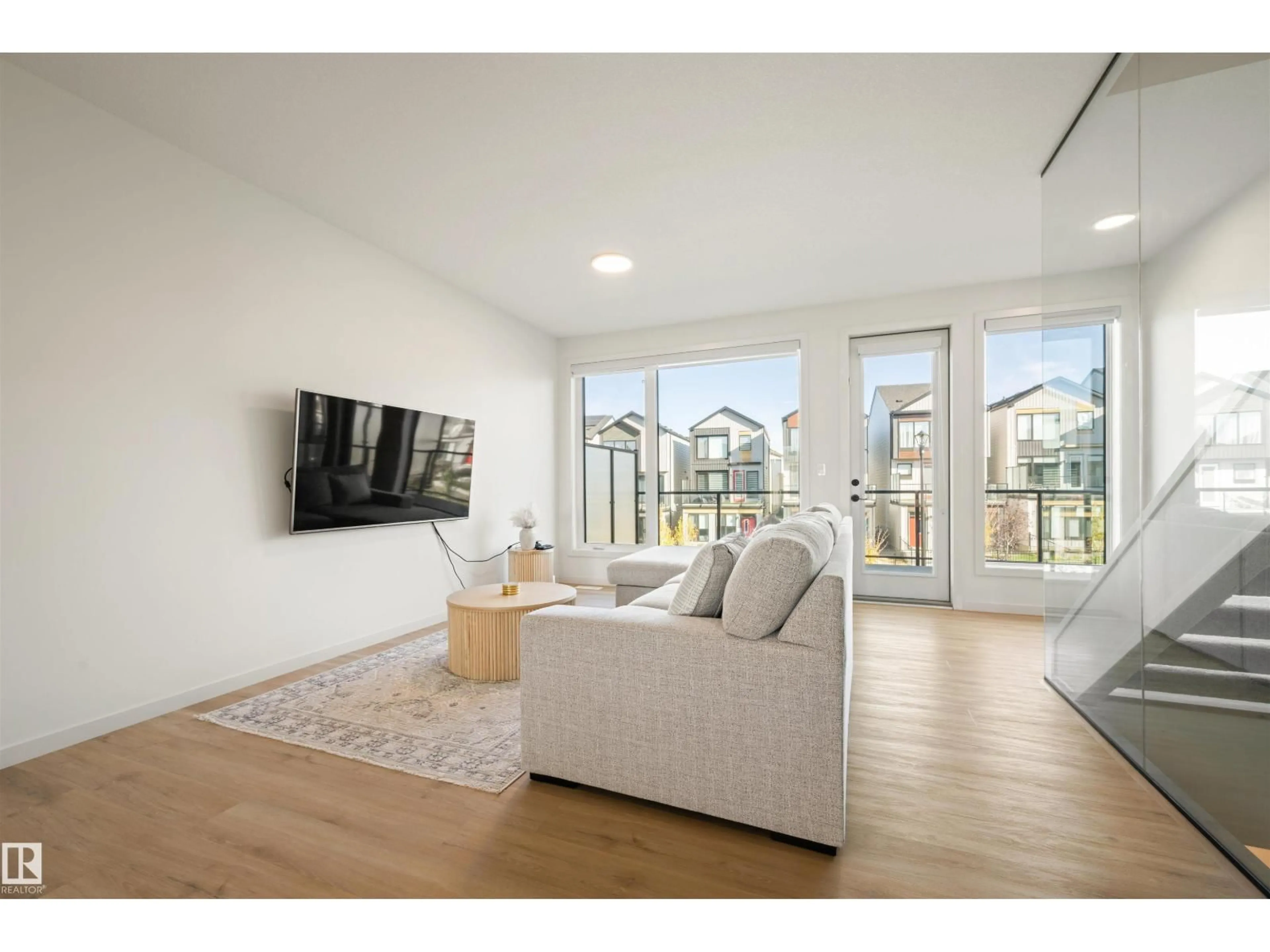 Living room with furniture, wood/laminate floor for SW - 459 39 ST, Edmonton Alberta T6X2X9