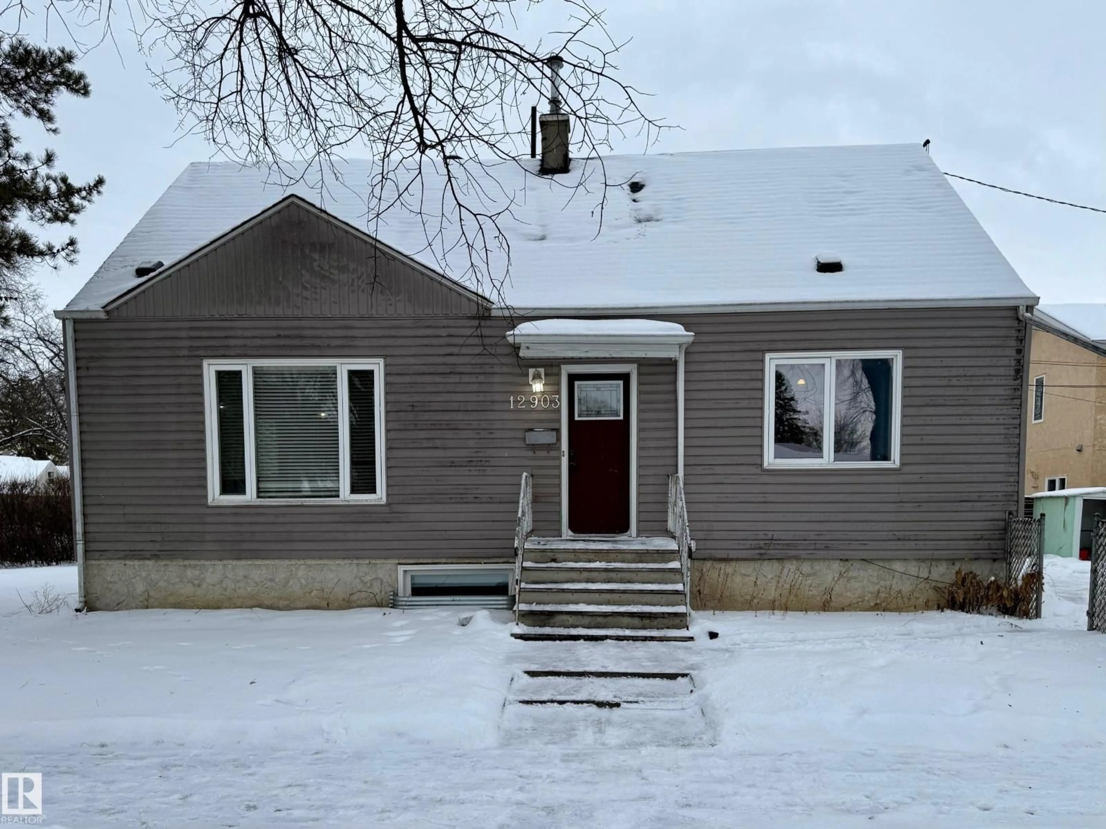 Home with vinyl exterior material, street for 12903 119A AV, Edmonton Alberta T5I0R9