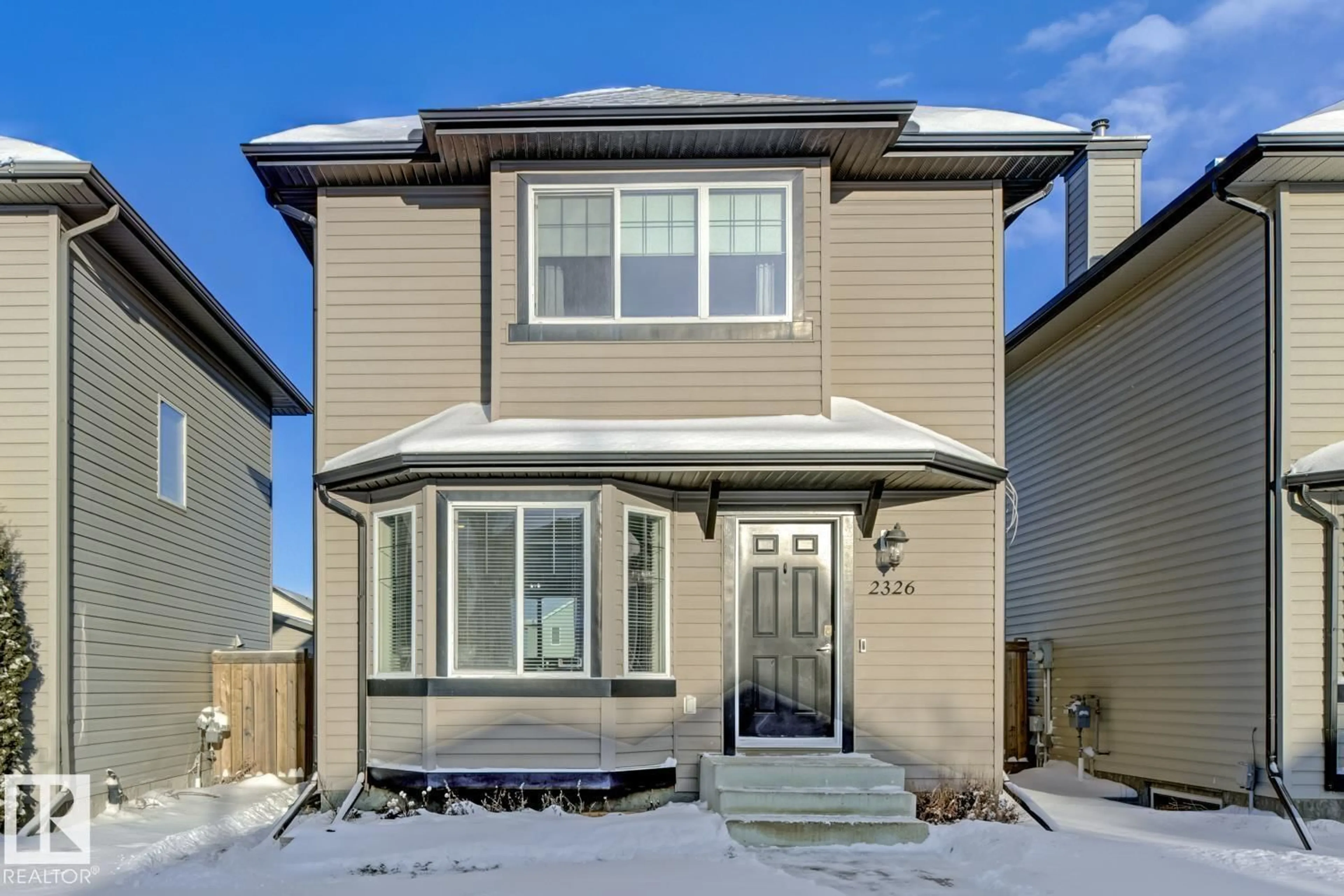 Home with vinyl exterior material, street for 2326 29A AV, Edmonton Alberta T6T2B2