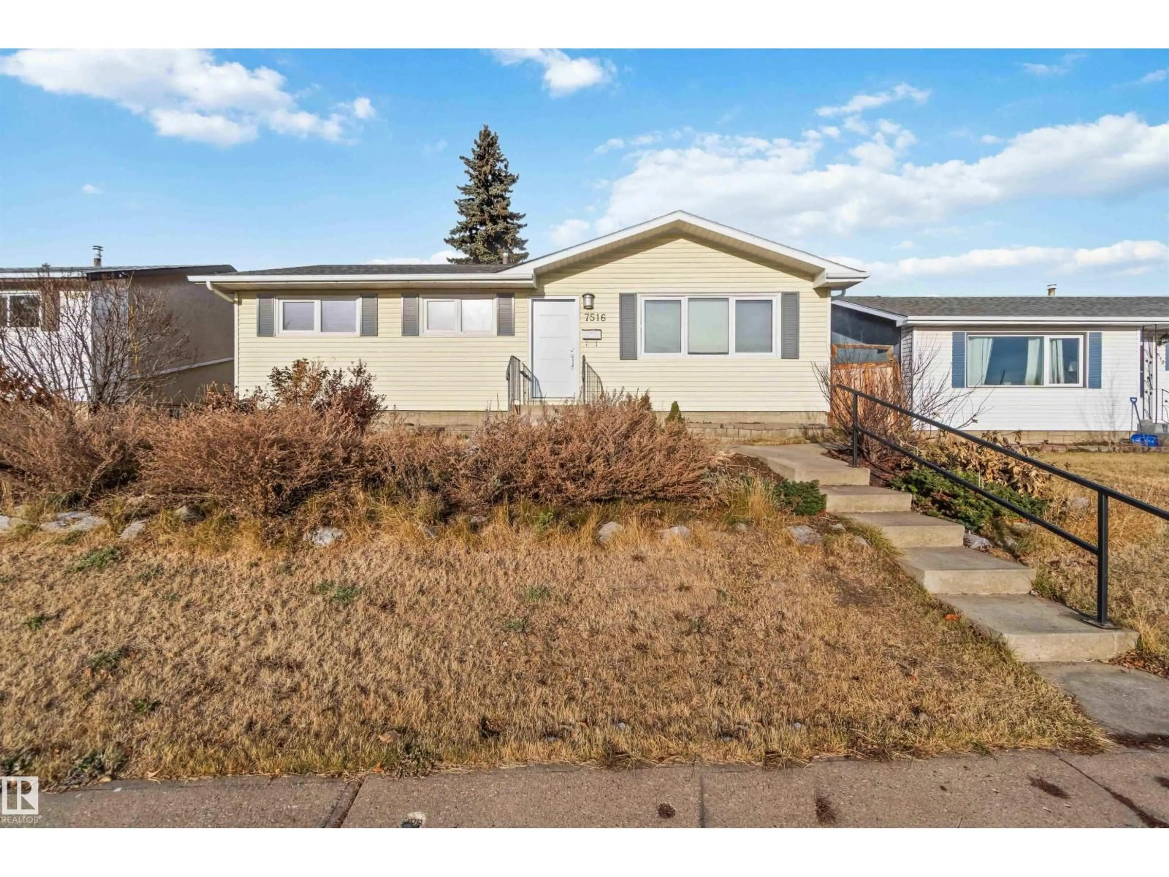A pic from outside/outdoor area/front of a property/back of a property/a pic from drone, street for 7516 136 AV, Edmonton Alberta T5C2K5