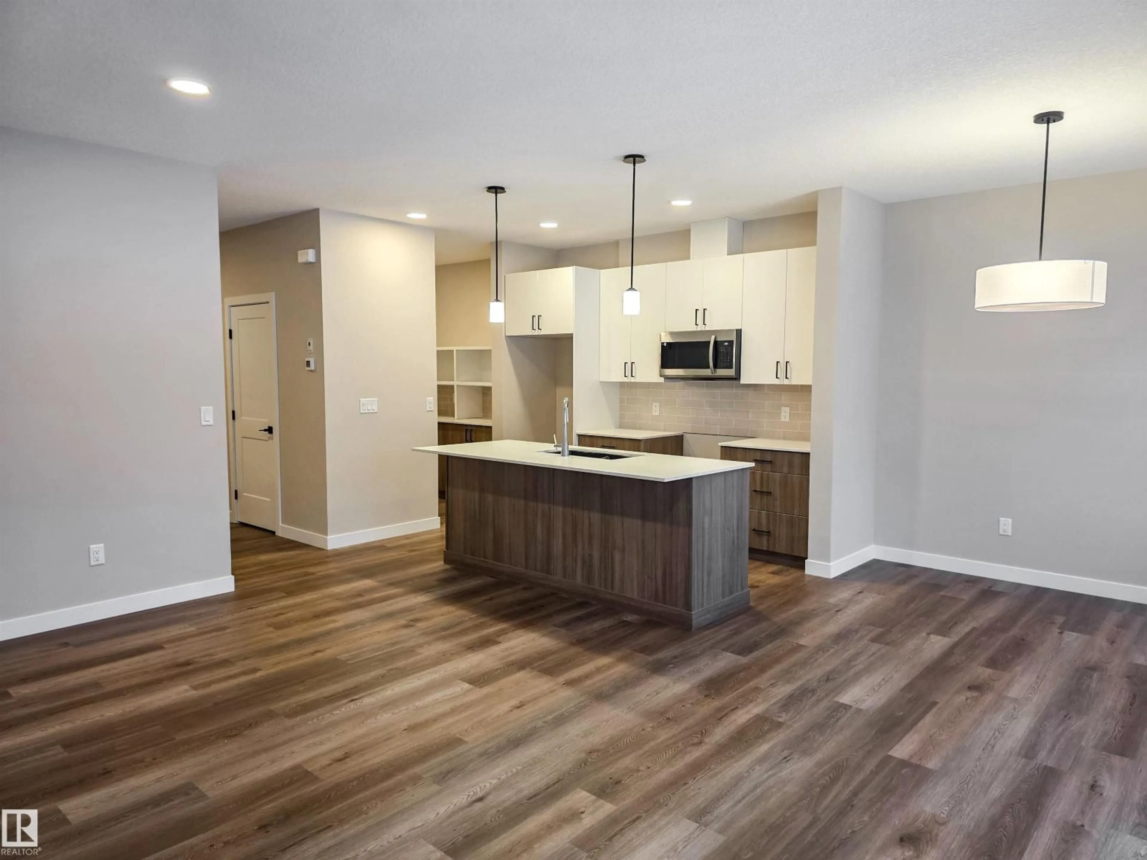 Open concept kitchen, wood/laminate floor for 137 HILTON CV, Spruce Grove Alberta T7X1Y4
