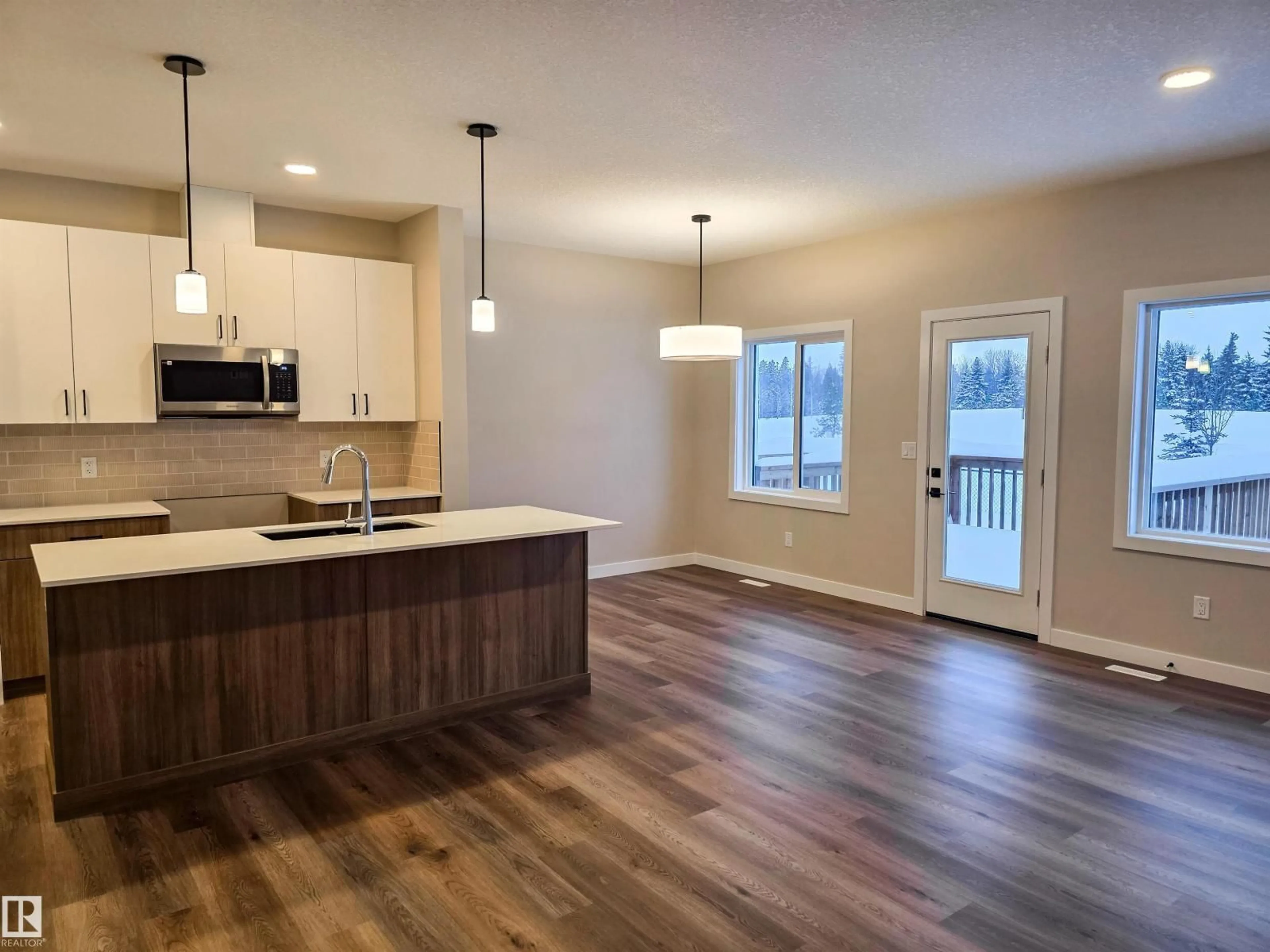 Open concept kitchen, wood/laminate floor for 137 HILTON CV, Spruce Grove Alberta T7X1Y4