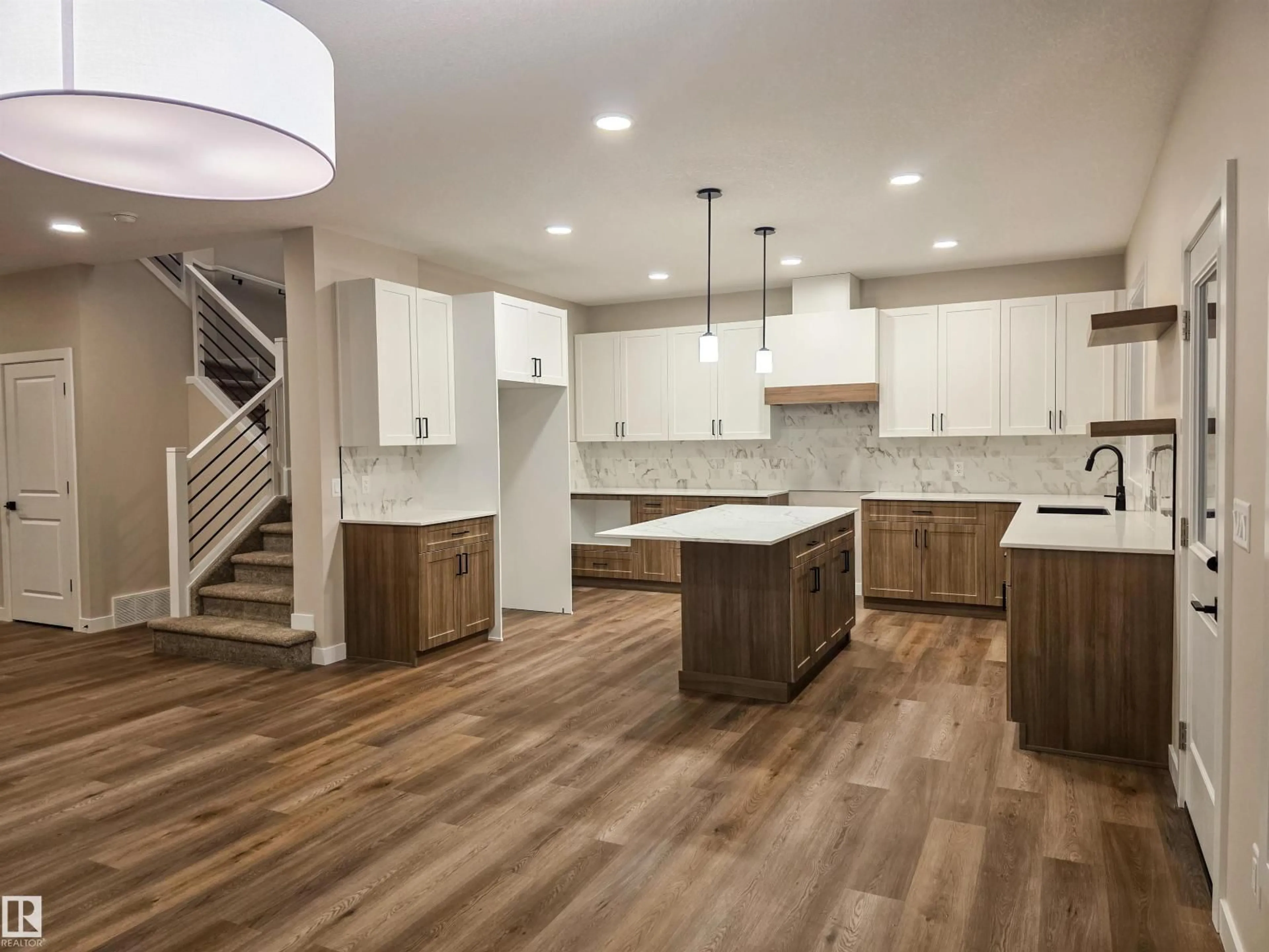 Open concept kitchen, wood/laminate floor for 3 EMERSON LD, Spruce Grove Alberta T7X4S2